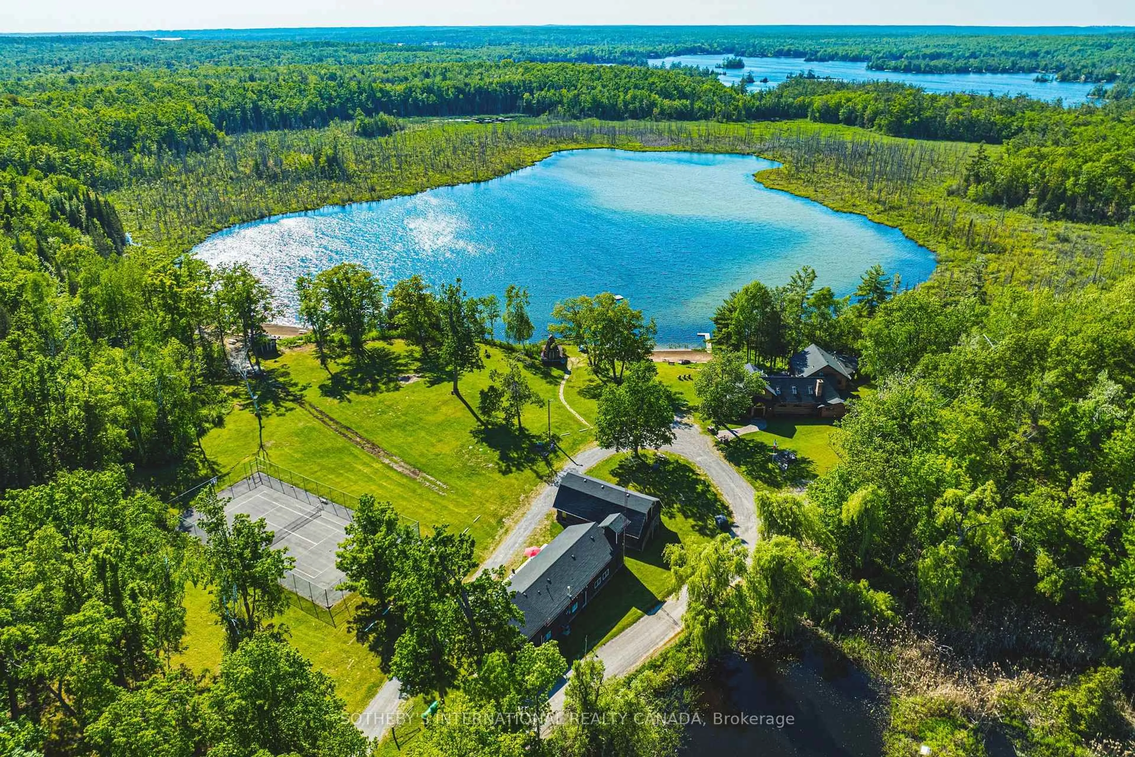 A pic from outside/outdoor area/front of a property/back of a property/a pic from drone, water/lake/river/ocean view for 215 Laplantes Rd, Trent Lakes Ontario K0L 1J0
