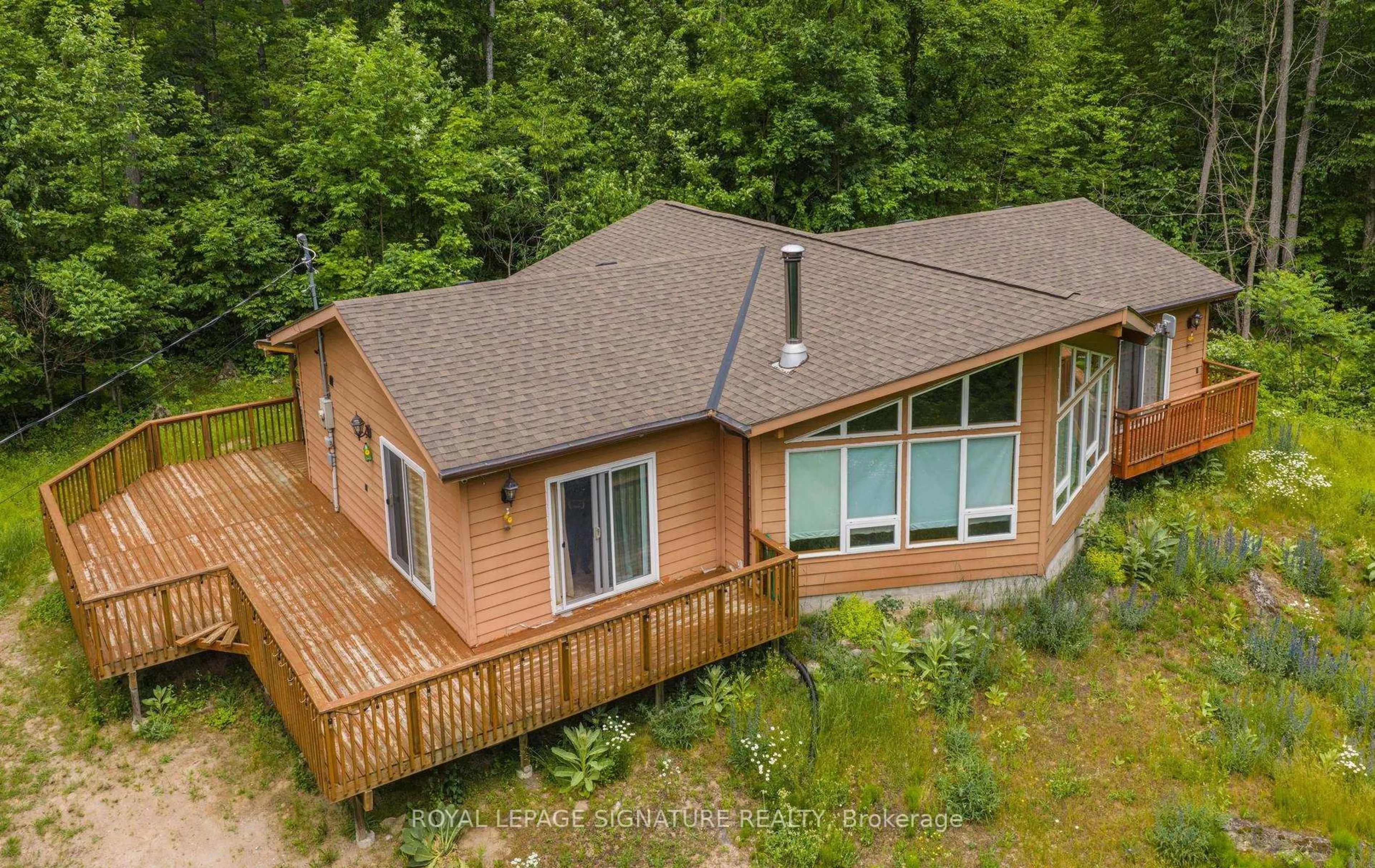 A pic from outside/outdoor area/front of a property/back of a property/a pic from drone, water/lake/river/ocean view for 369 Nichols Cove Rd, Trent Lakes Ontario K0M 1A0