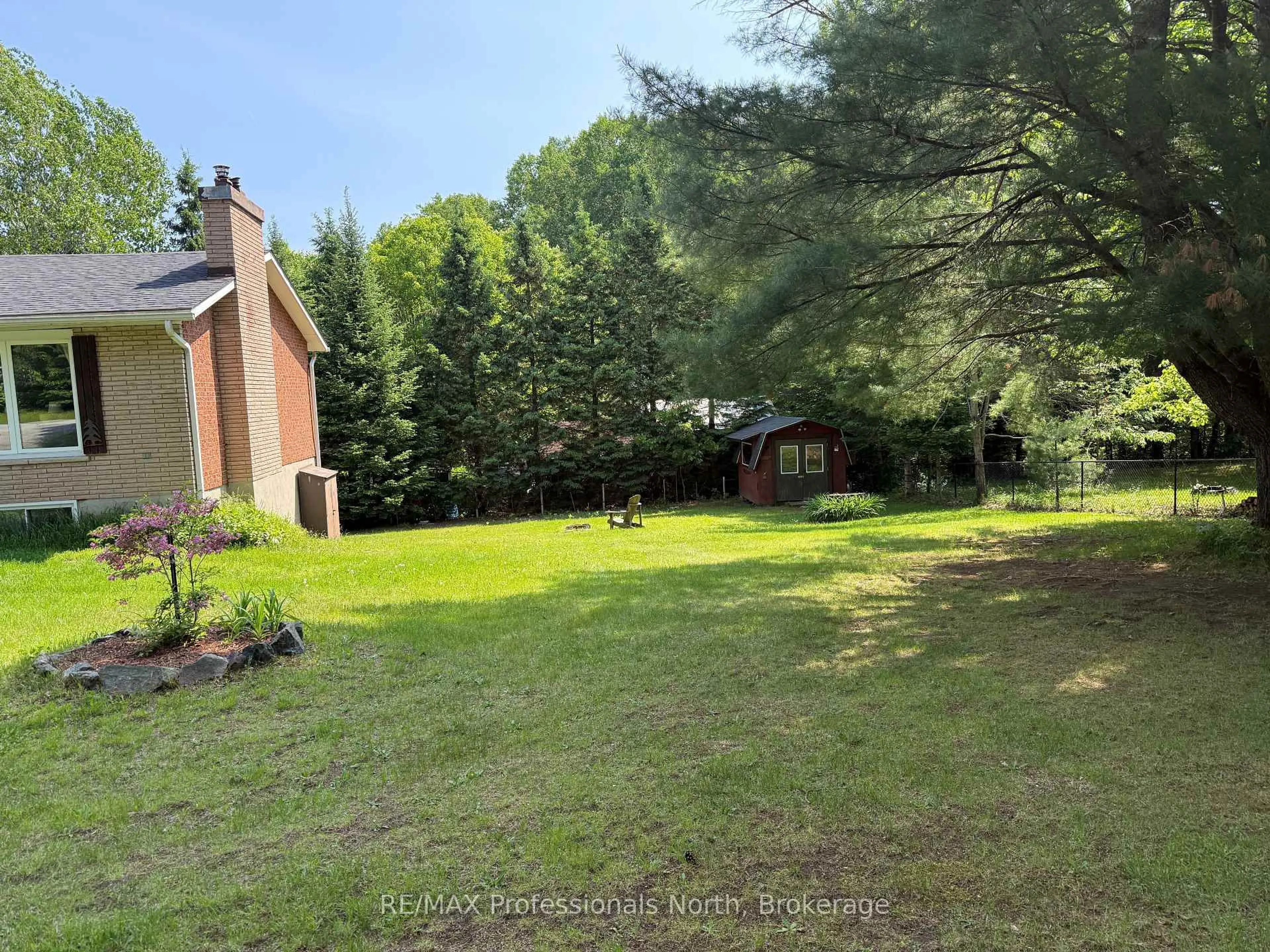 A pic from outside/outdoor area/front of a property/back of a property/a pic from drone, forest/trees view for 37 Spruce Dr, Huntsville Ontario P0B 1L0