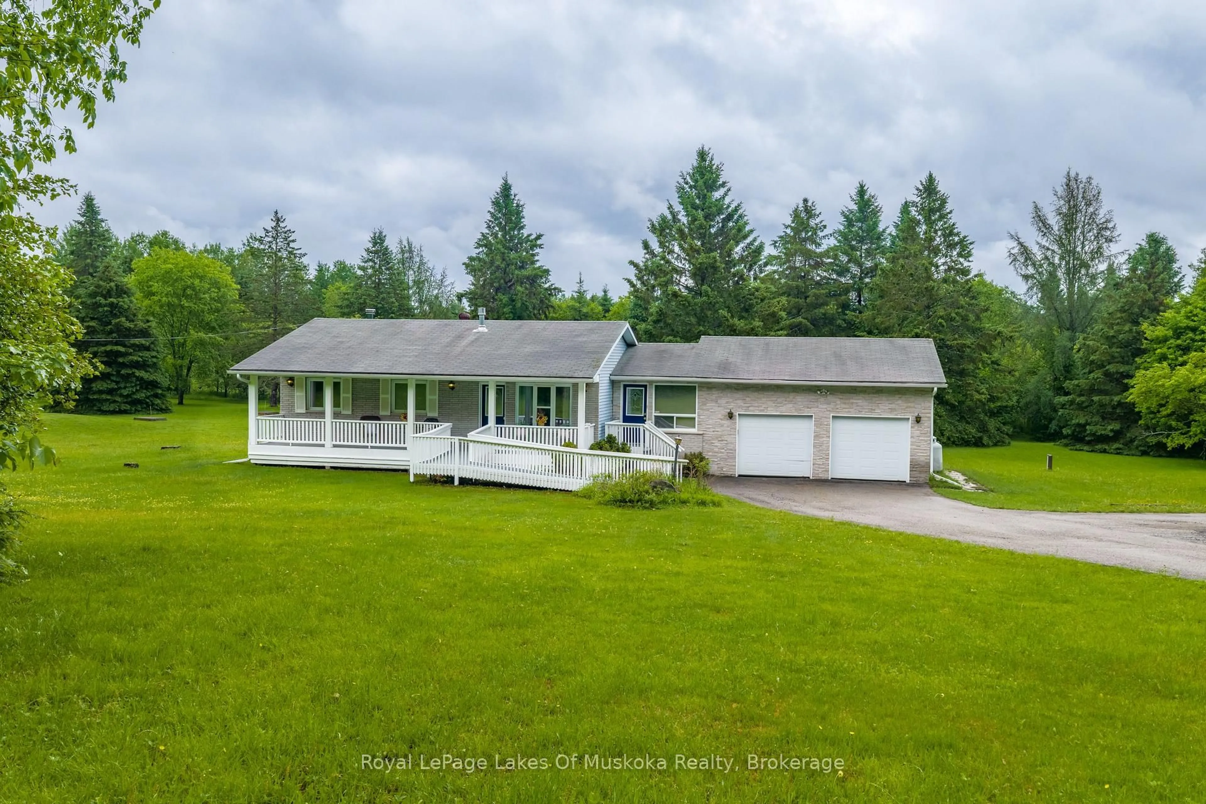 A pic from outside/outdoor area/front of a property/back of a property/a pic from drone, water/lake/river/ocean view for 625 Old North Rd, Huntsville Ontario P1H 2J4
