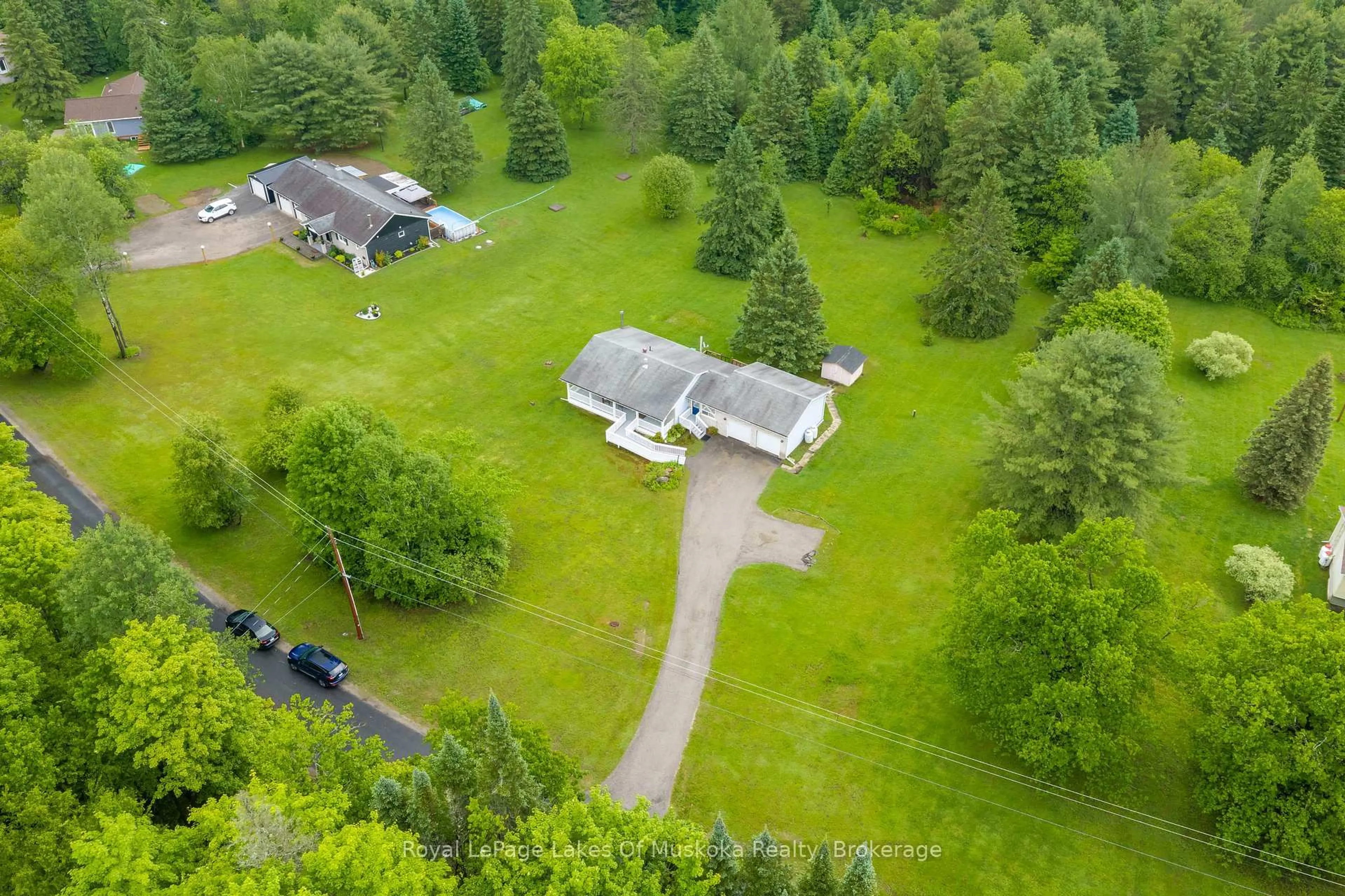 A pic from outside/outdoor area/front of a property/back of a property/a pic from drone, forest/trees view for 625 Old North Rd, Huntsville Ontario P1H 2J4
