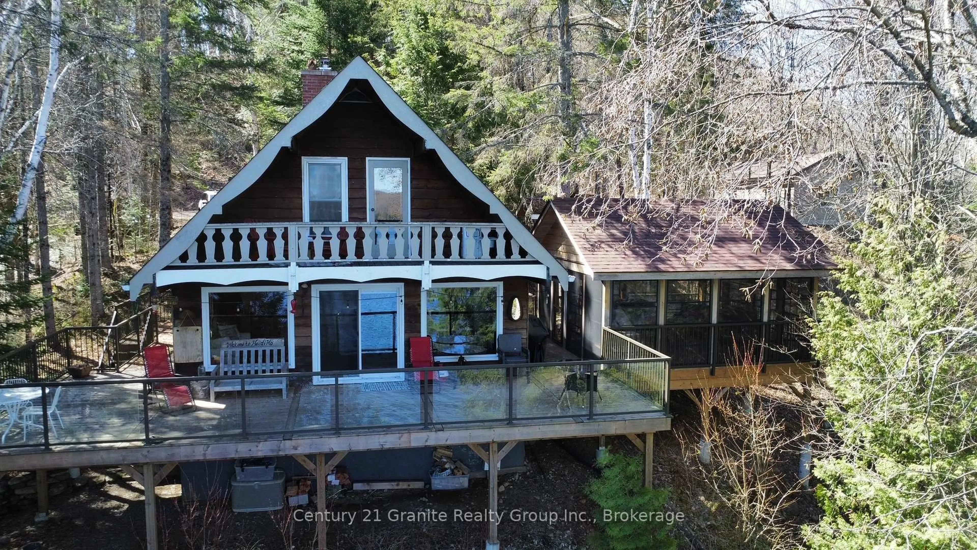 A pic from outside/outdoor area/front of a property/back of a property/a pic from drone, water/lake/river/ocean view for 1038 Broken Paddle Rd, Dysart et al Ontario K0M 1S0