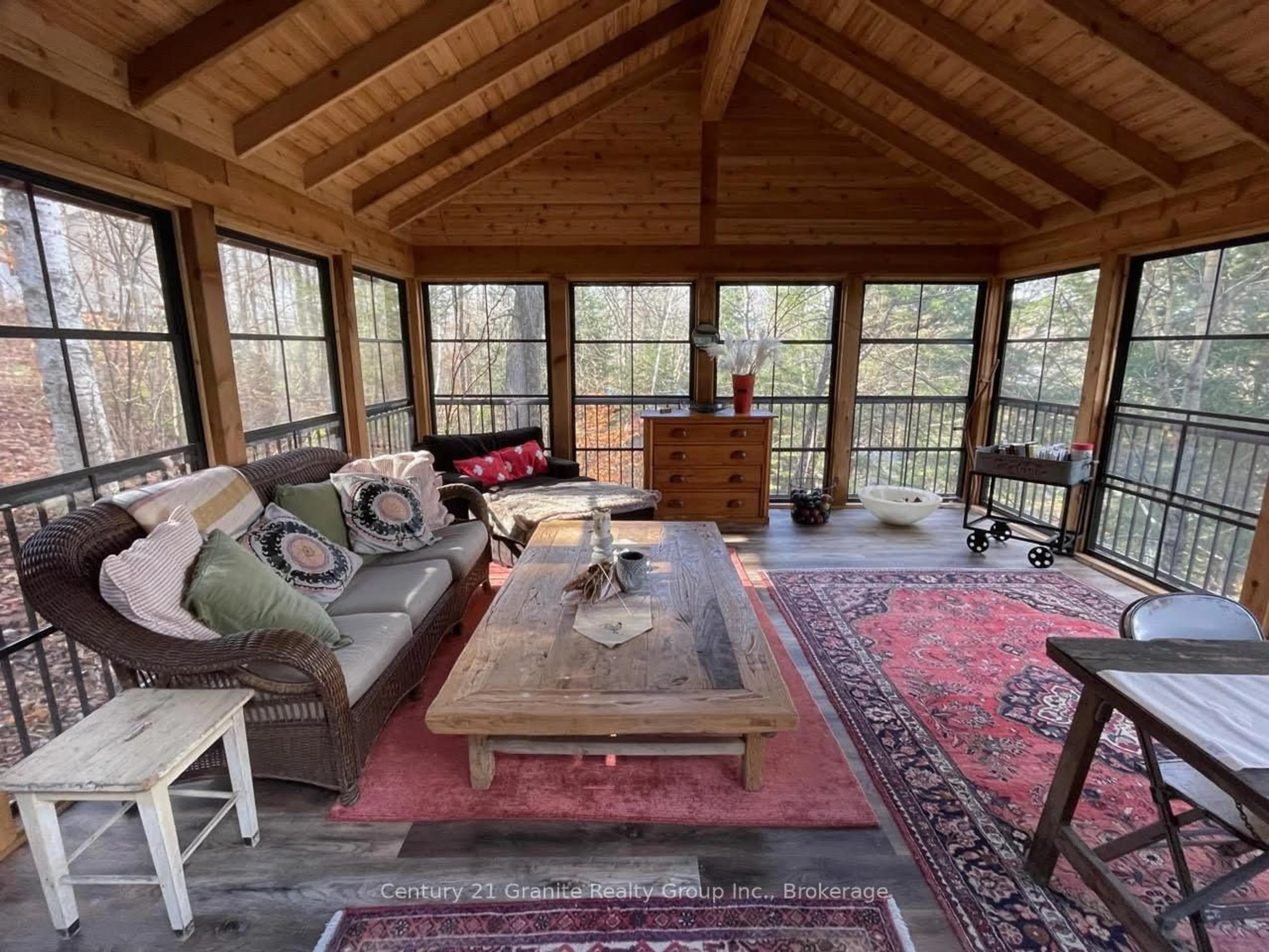 Living room with furniture, wood/laminate floor for 1038 Broken Paddle Rd, Dysart et al Ontario K0M 1S0