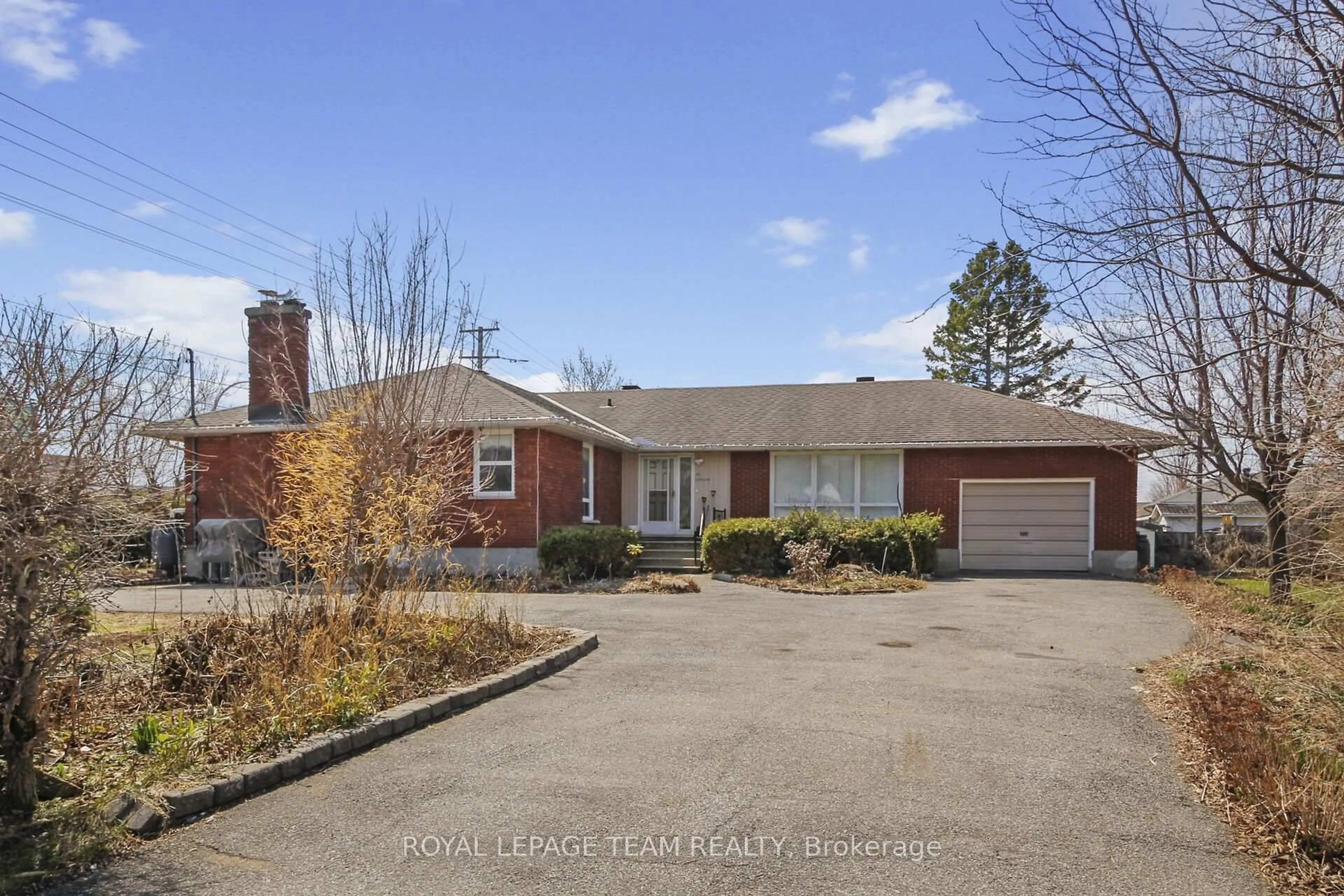 Home with brick exterior material, street for 45 Capilano Dr, Ottawa Ontario K2E 6G5