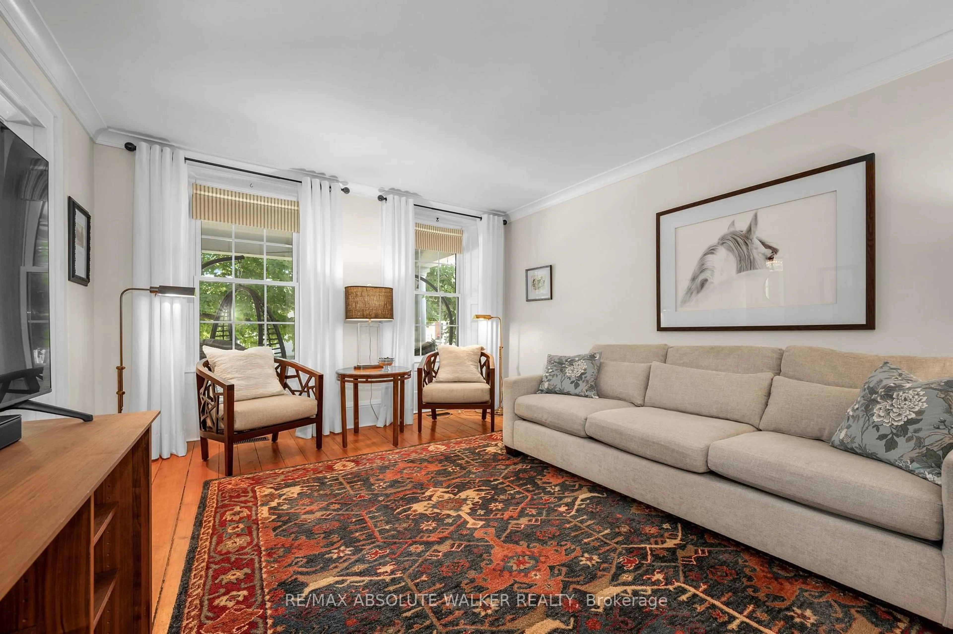 Living room with furniture, carpet floor for 652 Henry St, Prescott Ontario K0E 1T0