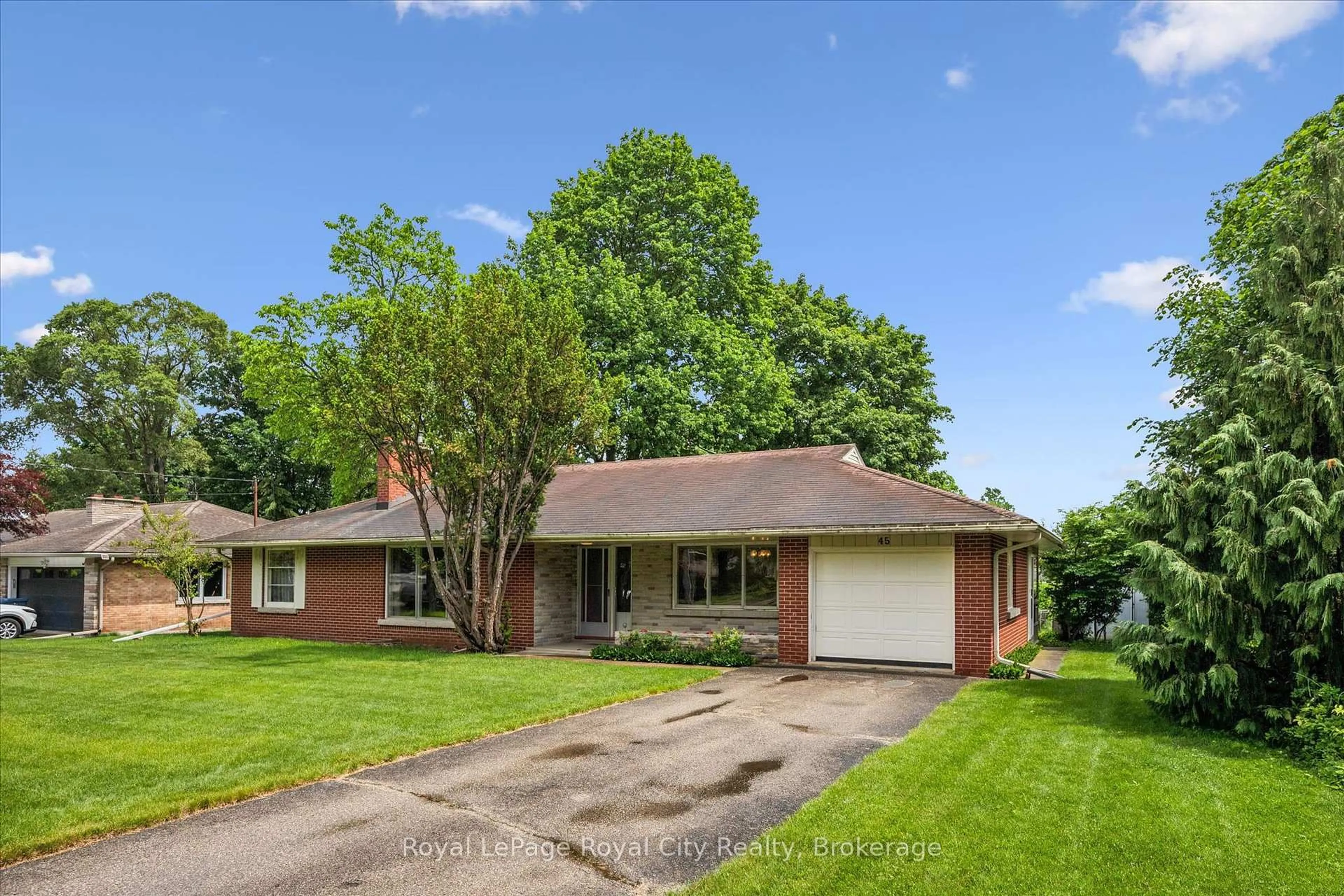 Home with brick exterior material, street for 45 Waverley Dr, Guelph Ontario N1E 1G7