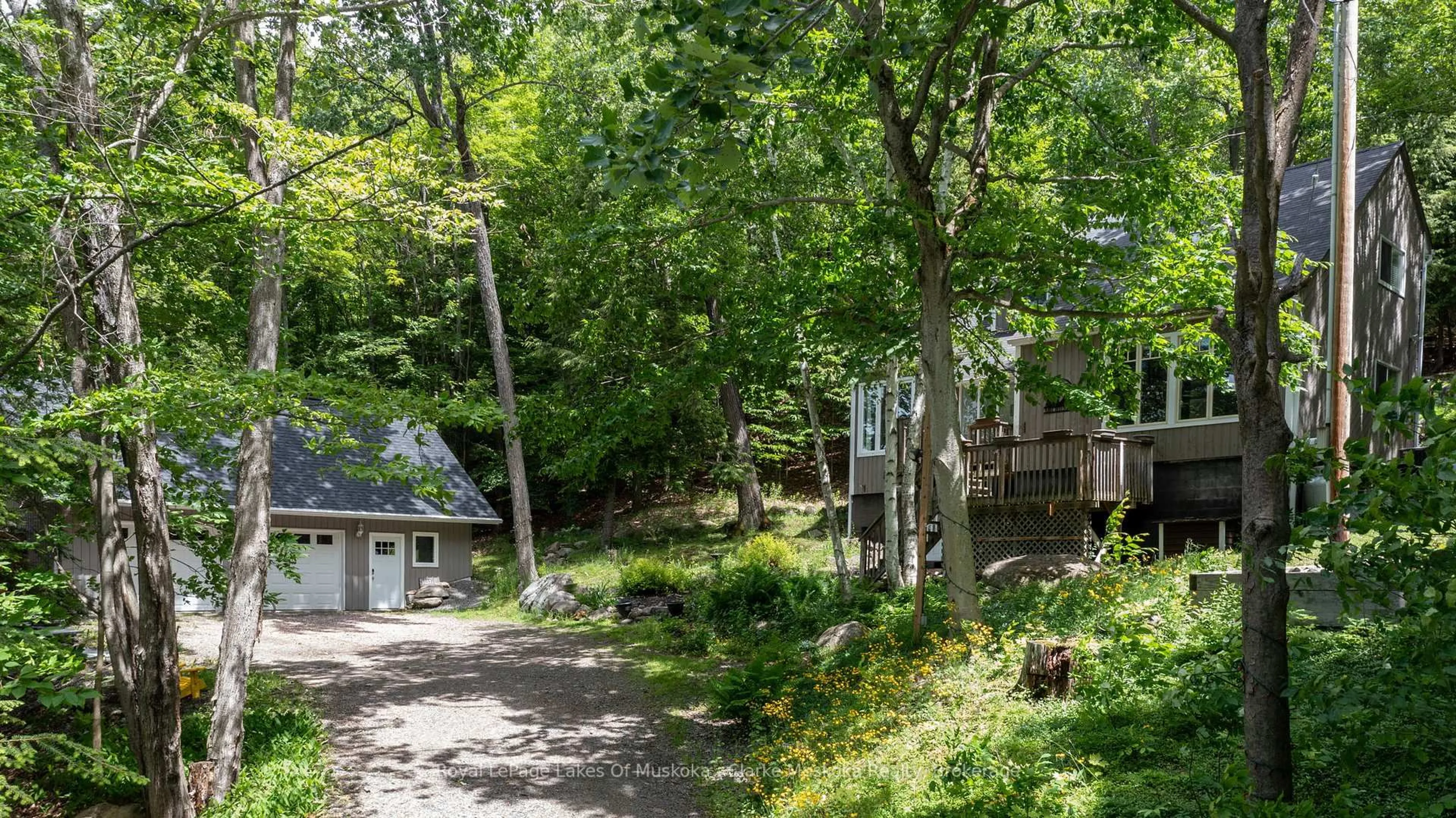 A pic from outside/outdoor area/front of a property/back of a property/a pic from drone, street for 1037 Foreman Rd, Muskoka Lakes Ontario P0B 1J0