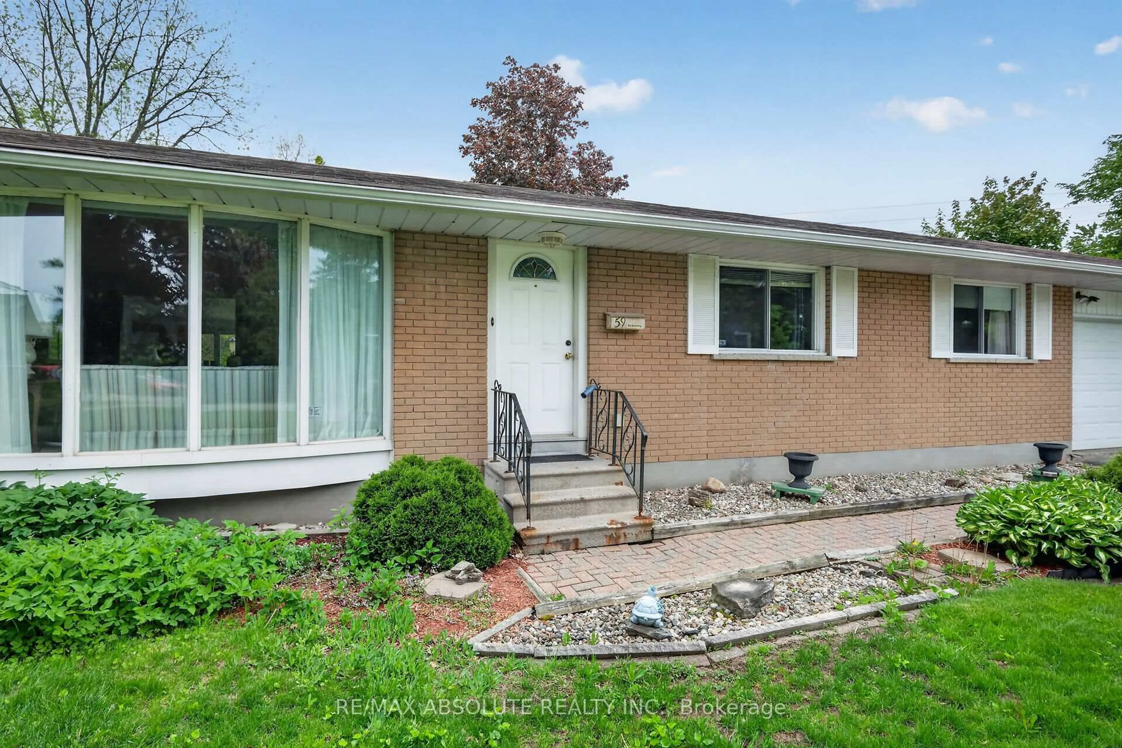 Home with brick exterior material, street for 59 Evergreen Dr, Ottawa Ontario K2H 6C5