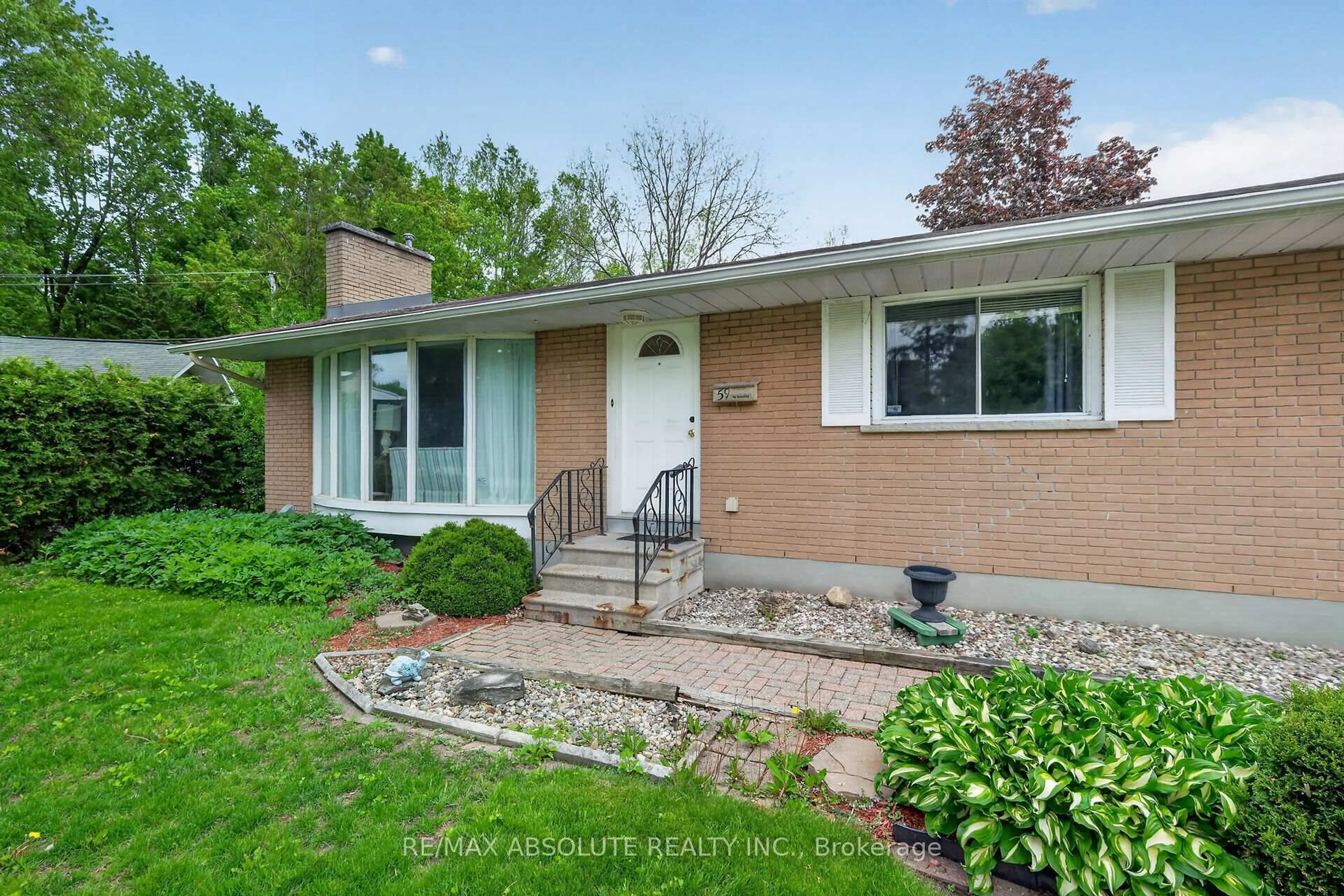 Home with brick exterior material, street for 59 Evergreen Dr, Ottawa Ontario K2H 6C5