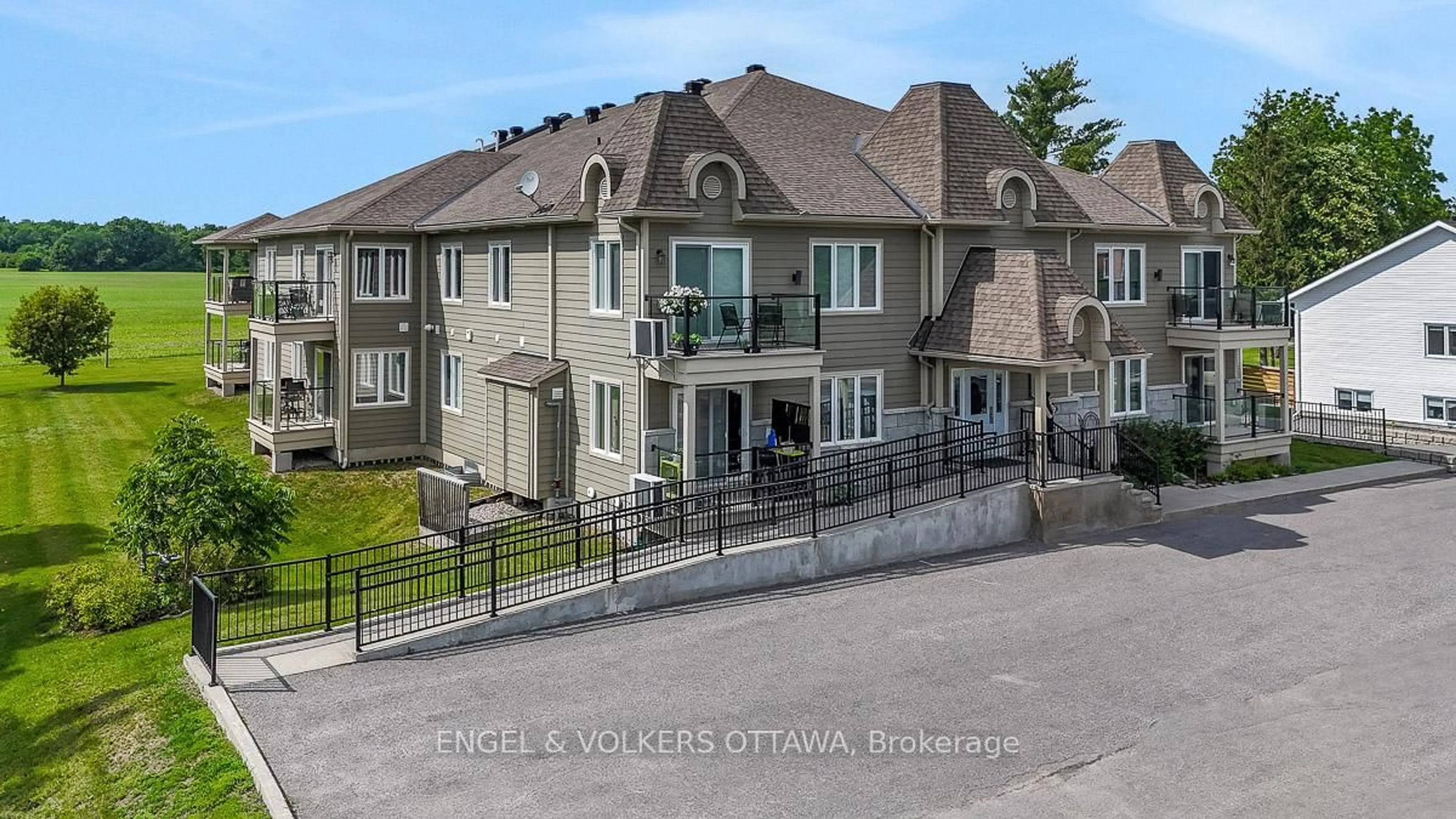 A pic from outside/outdoor area/front of a property/back of a property/a pic from drone, unknown for 38 Charles St #202, North Stormont Ontario K0A 1R0