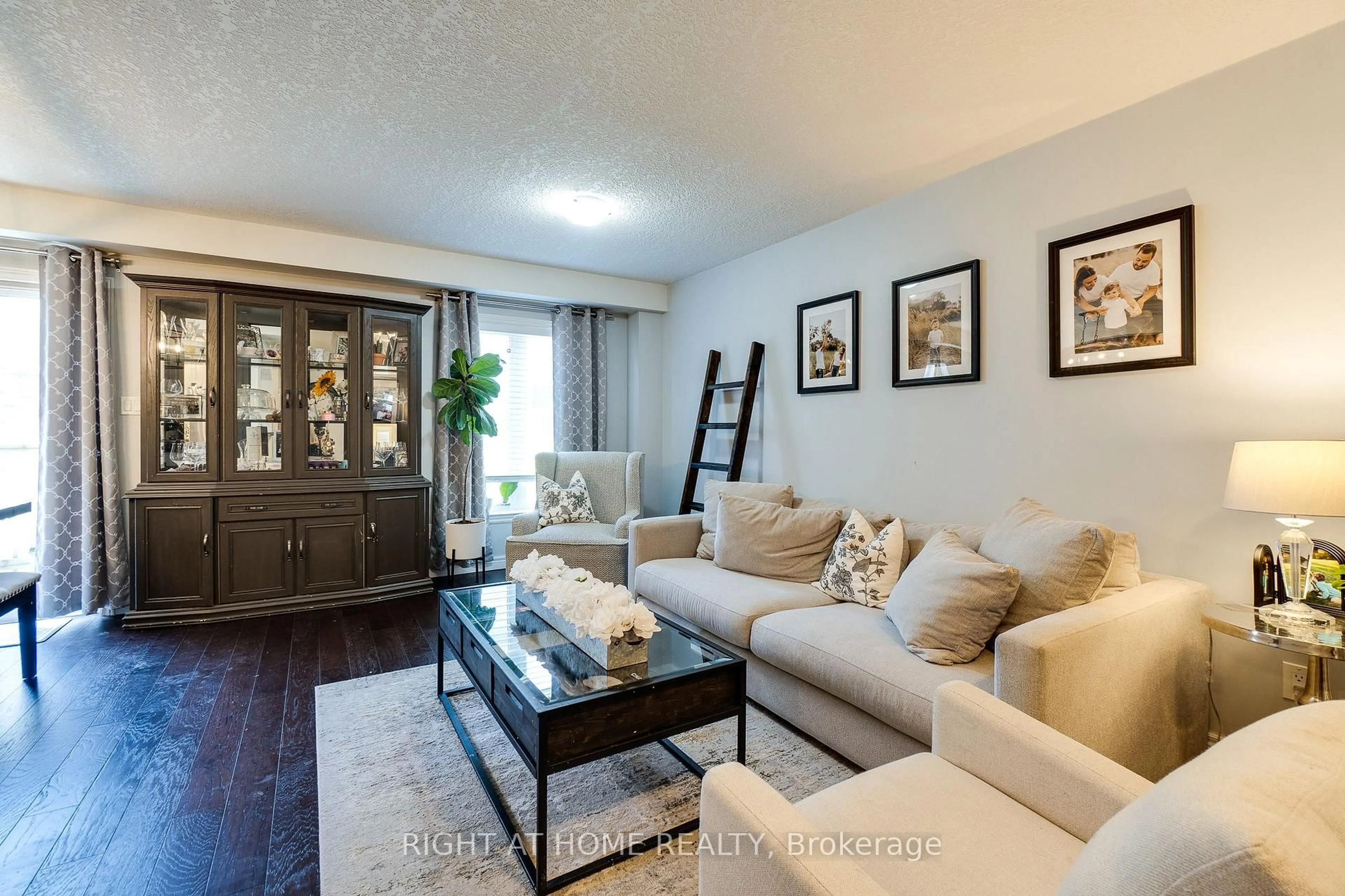 Living room with furniture, wood/laminate floor for 70 Highgate Dr #12, Hamilton Ontario L8J 0E8