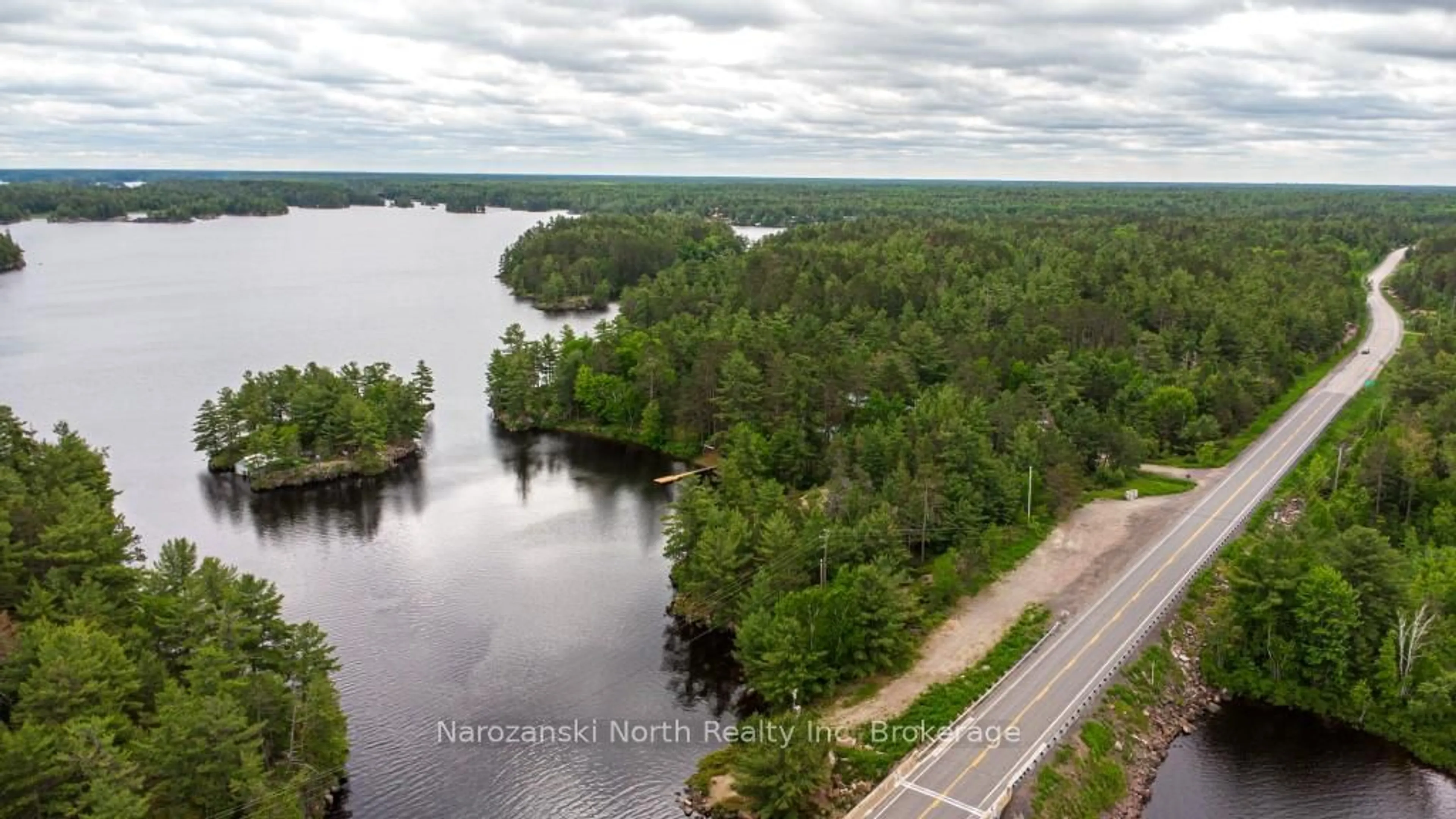 A pic from outside/outdoor area/front of a property/back of a property/a pic from drone, water/lake/river/ocean view for 8162 Hwy 64 Highway, French River Ontario P0M 2K0