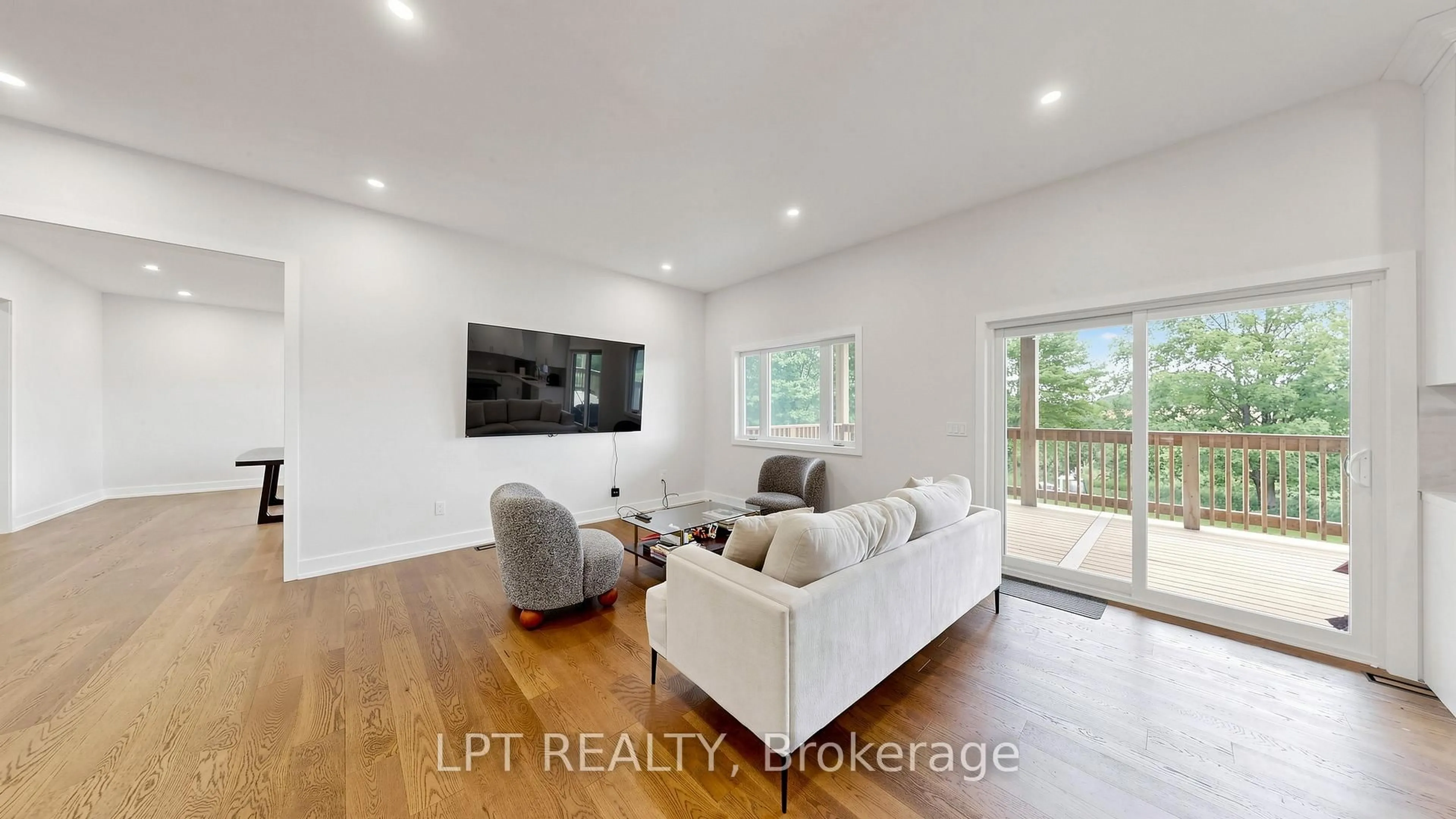 Living room with furniture, wood/laminate floor for 518644 County 124 Rd, Melancthon Ontario L9V 1W4