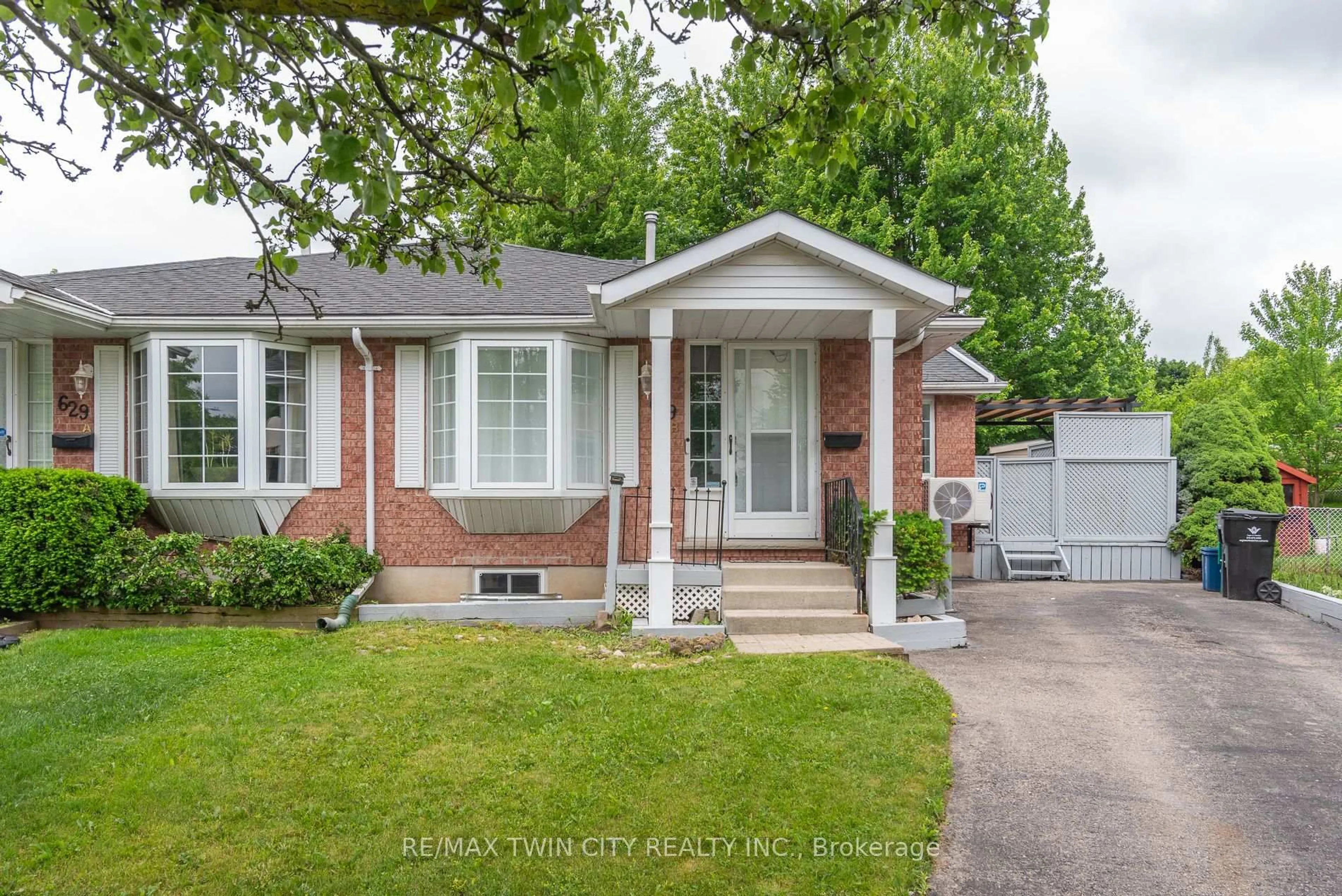 Home with brick exterior material, street for 629B Settlersfield Crt, Waterloo Ontario N2T 2K6