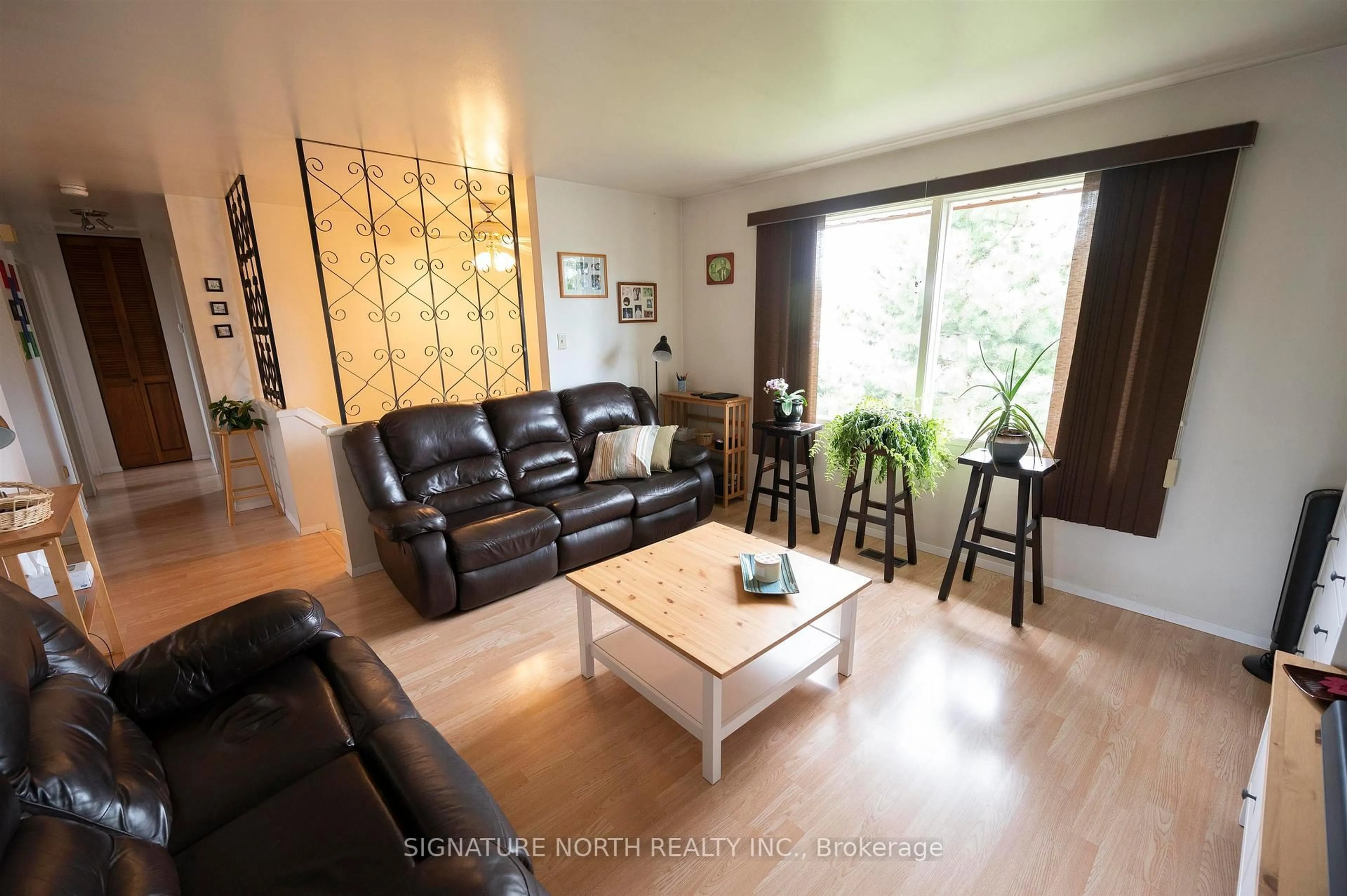 Living room with furniture, wood/laminate floor for 936 Huron Avenue, Thunder Bay Ontario P7A 6L3