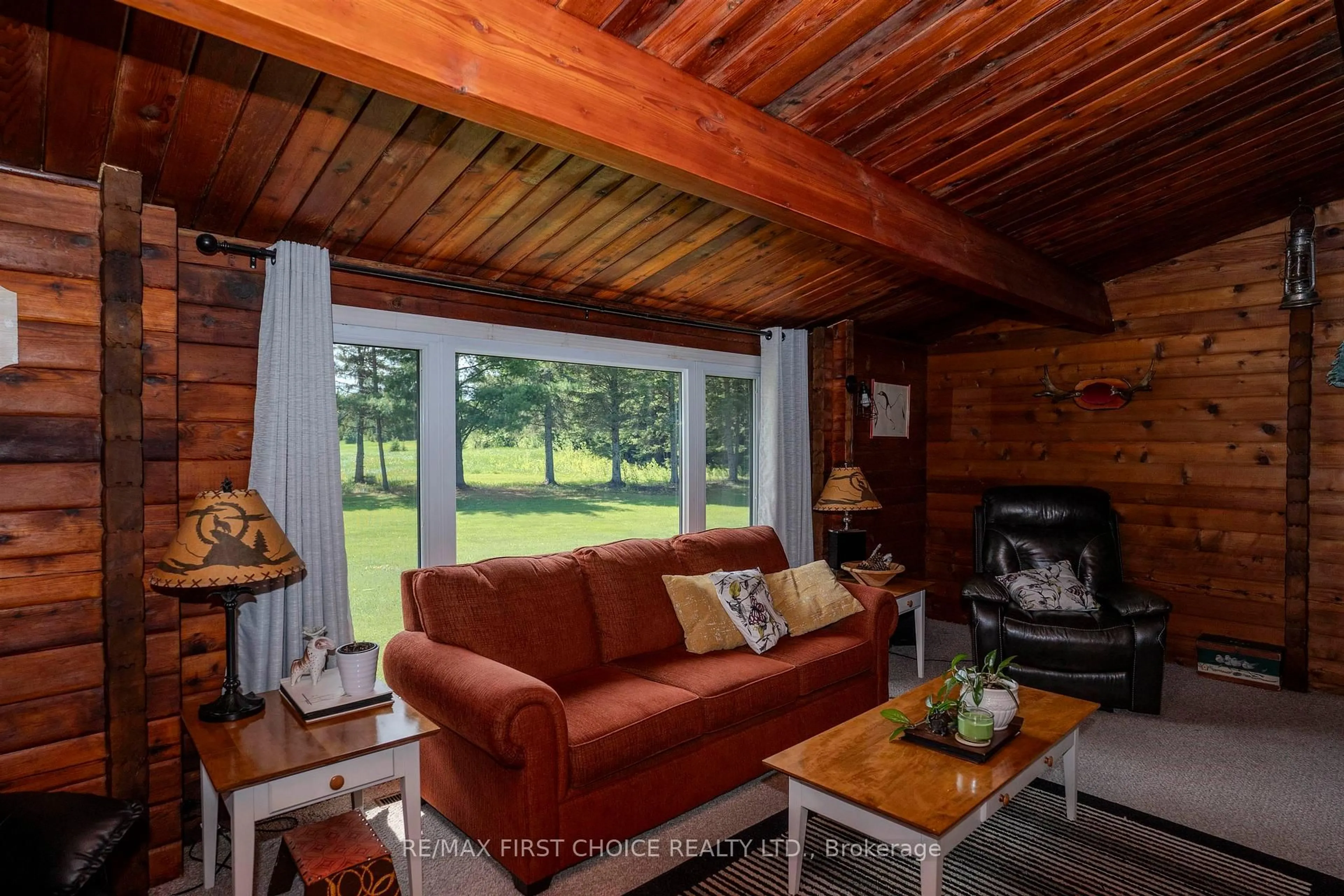 Living room with furniture, wood/laminate floor for 61 Oliver Creek Rd, Neebing Ontario P7L 0C3