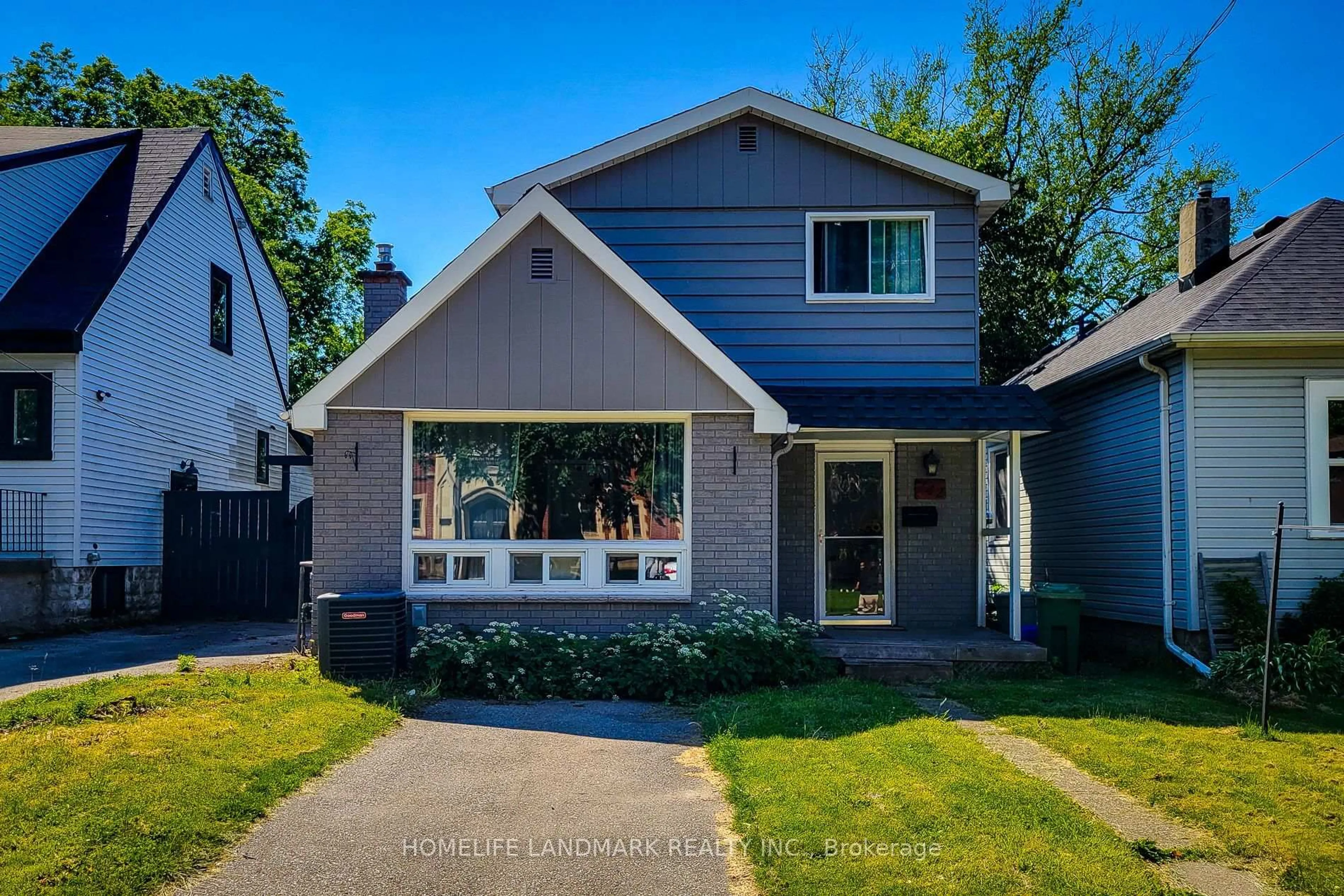 Home with vinyl exterior material, street for 242 Bowman St, Hamilton Ontario L8S 2V2