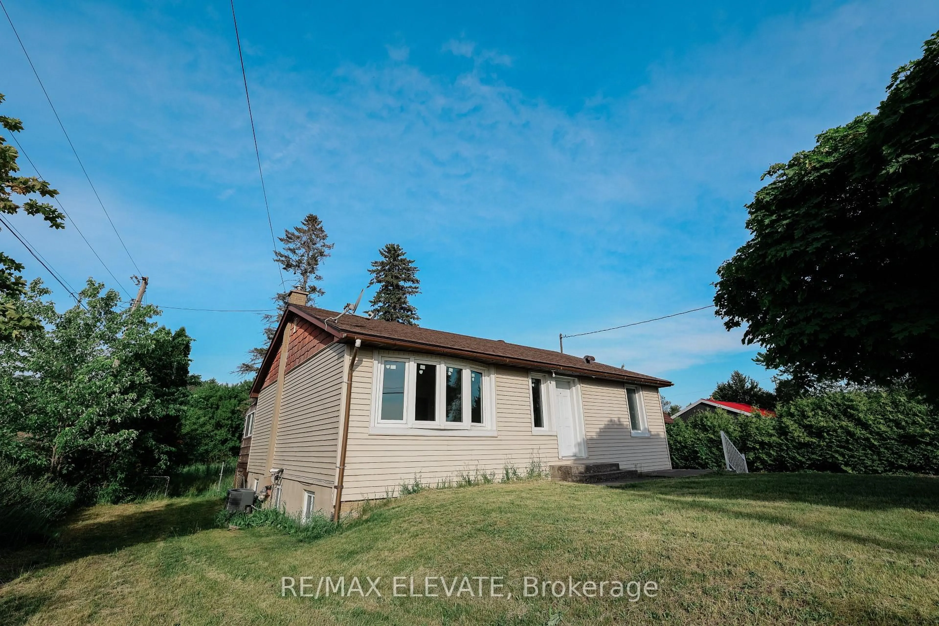 A pic from outside/outdoor area/front of a property/back of a property/a pic from drone, street for 106 Whites Rd, Quinte West Ontario K8V 5P5