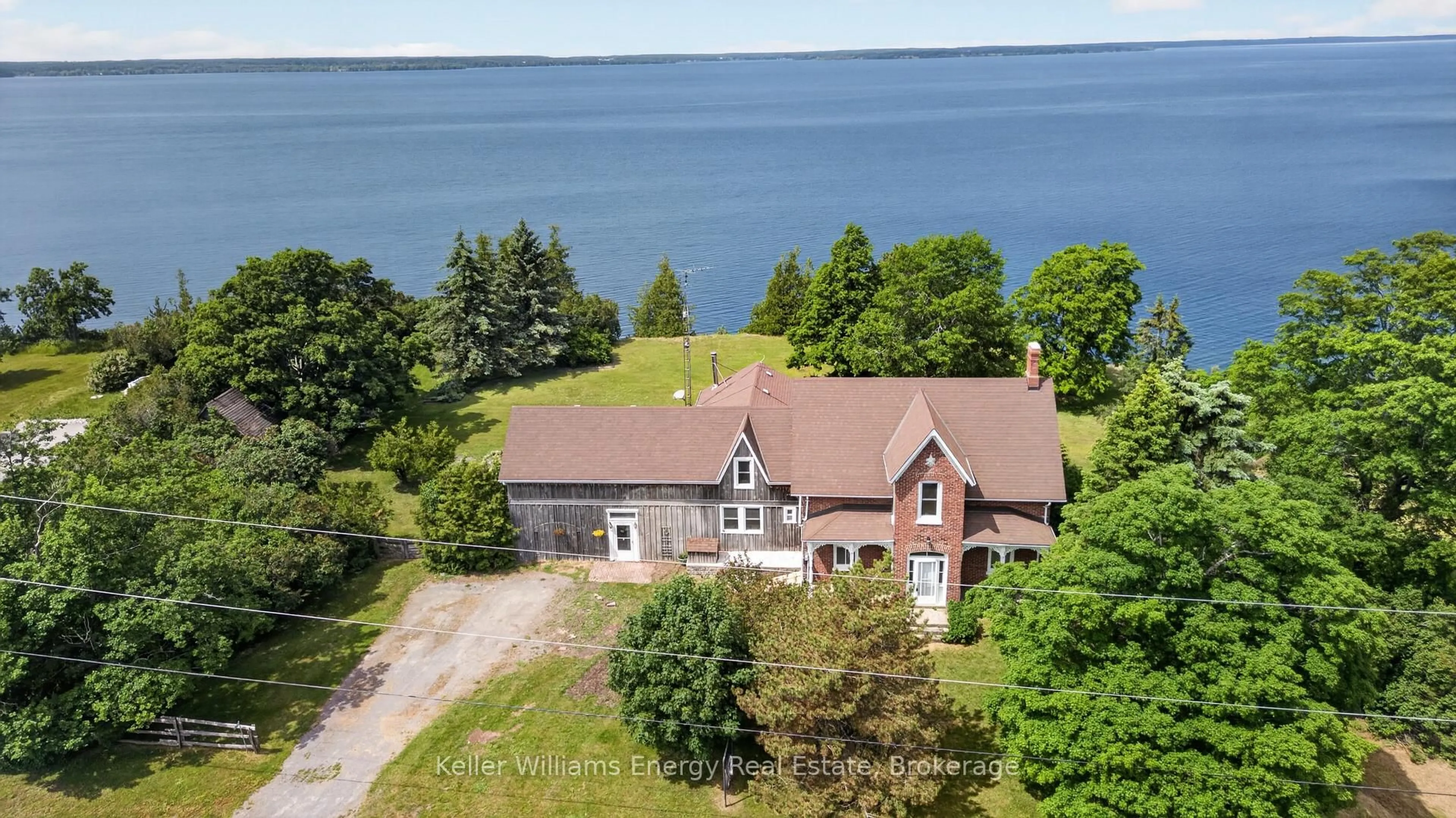 A pic from outside/outdoor area/front of a property/back of a property/a pic from drone, water/lake/river/ocean view for 3753 County Rd 13, Prince Edward County Ontario K0K 2T0