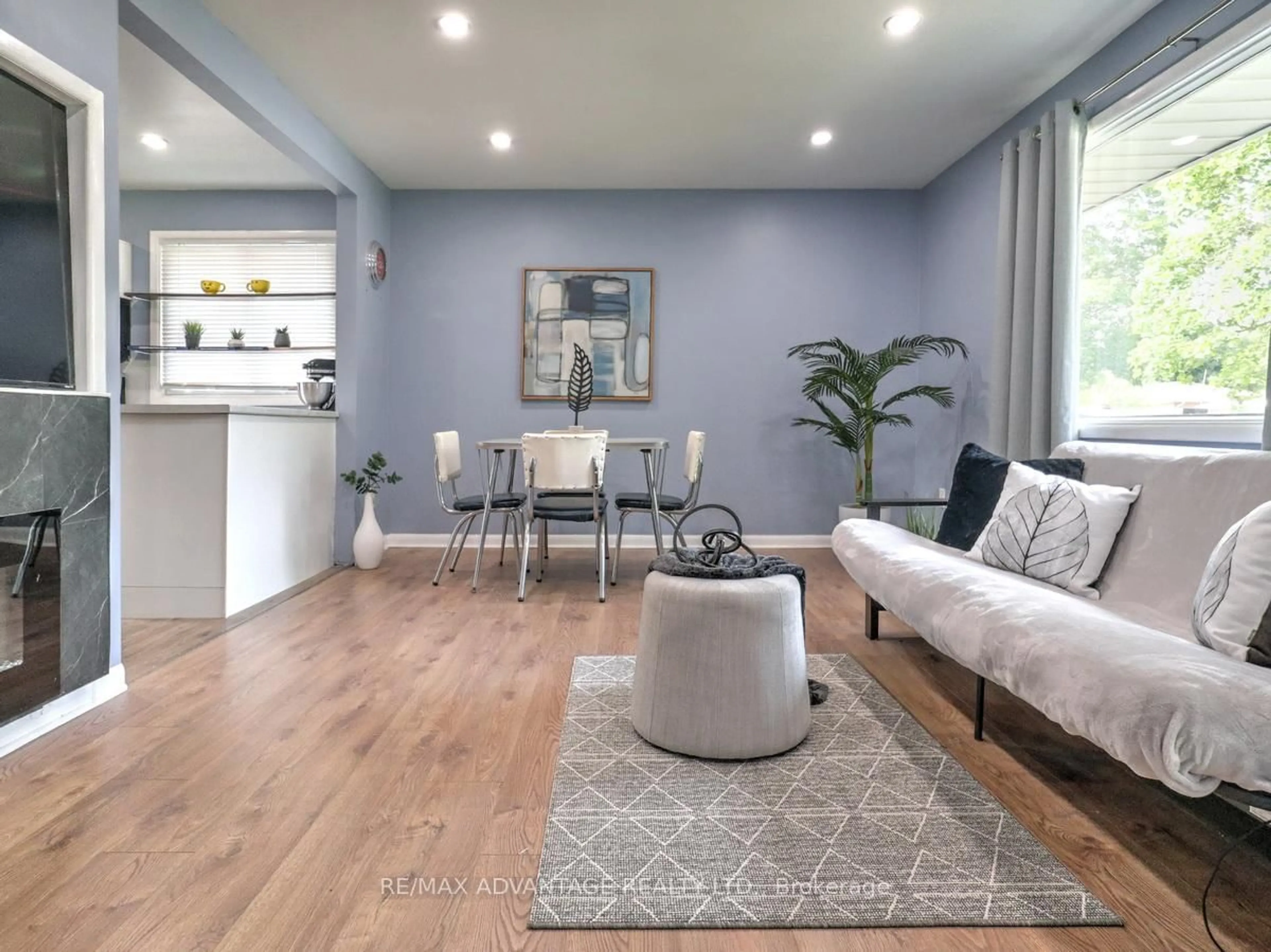 Living room with furniture, wood/laminate floor for 63 Pawnee Cres, London East Ontario N5V 2T2