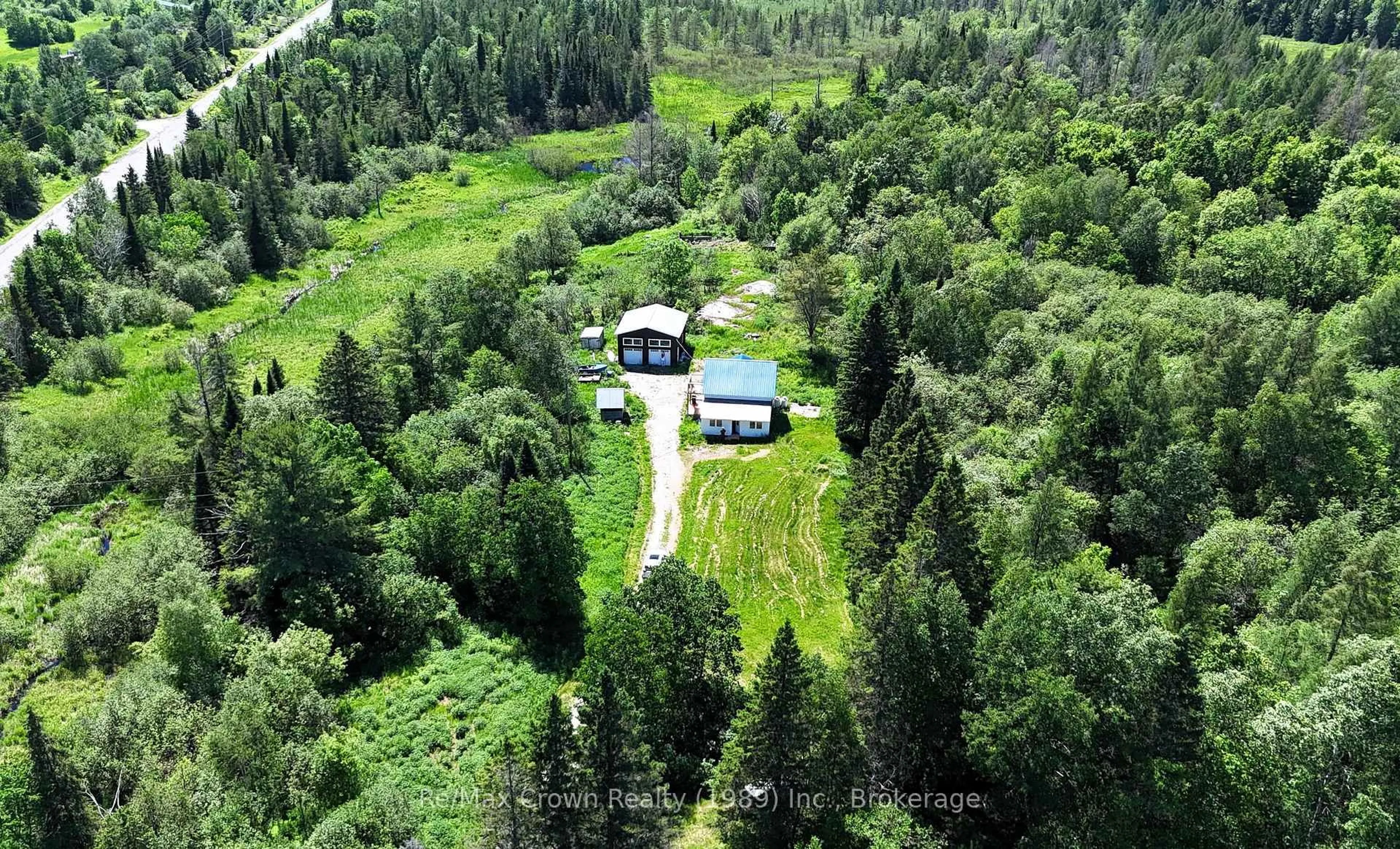 A pic from outside/outdoor area/front of a property/back of a property/a pic from drone, forest/trees view for 5 20th Side Rd, Parry Sound Remote Area Ontario P0H 1Y0