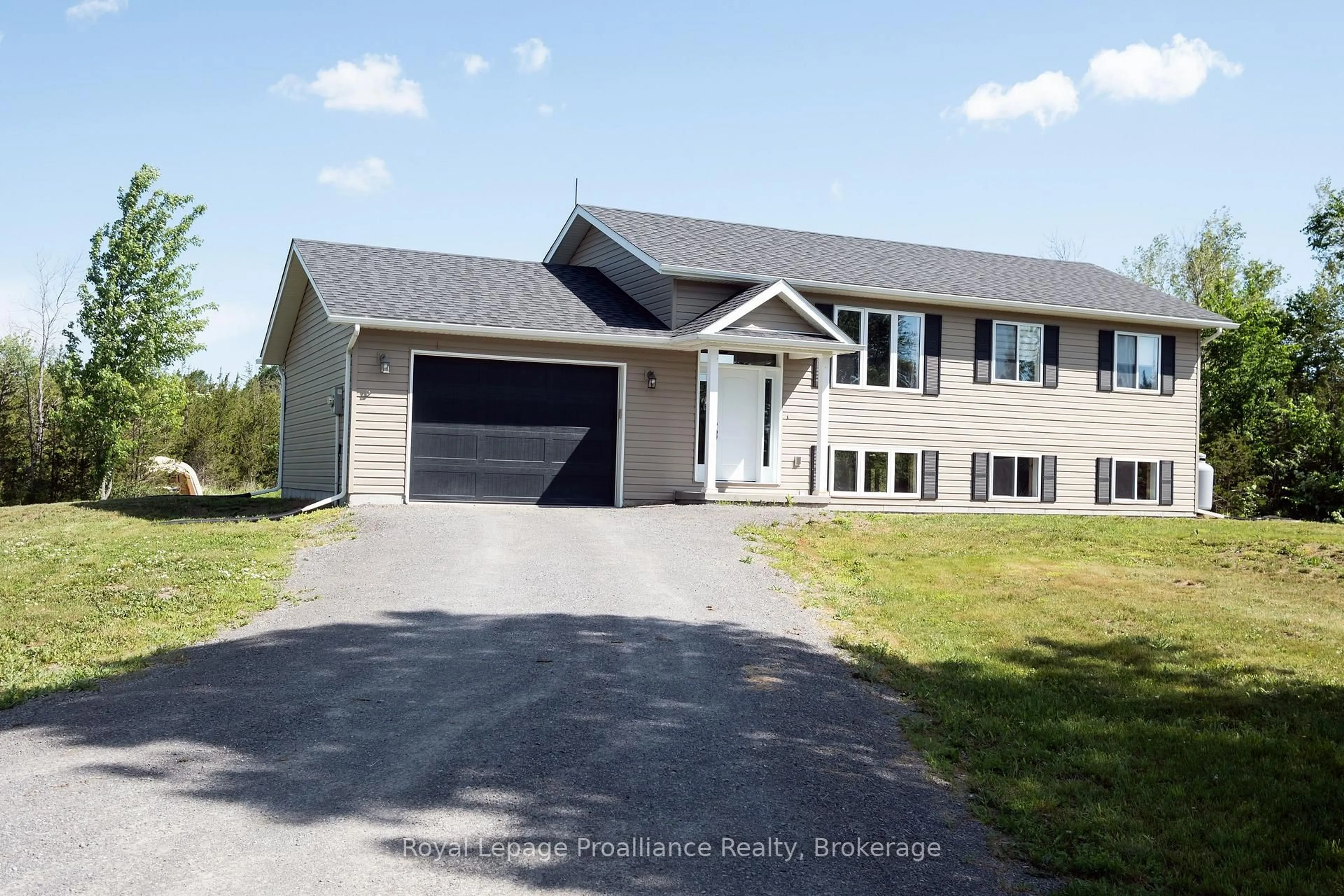 Home with vinyl exterior material, street for 741 Callaghan Rd, Shannonville Ontario K0K 2N0