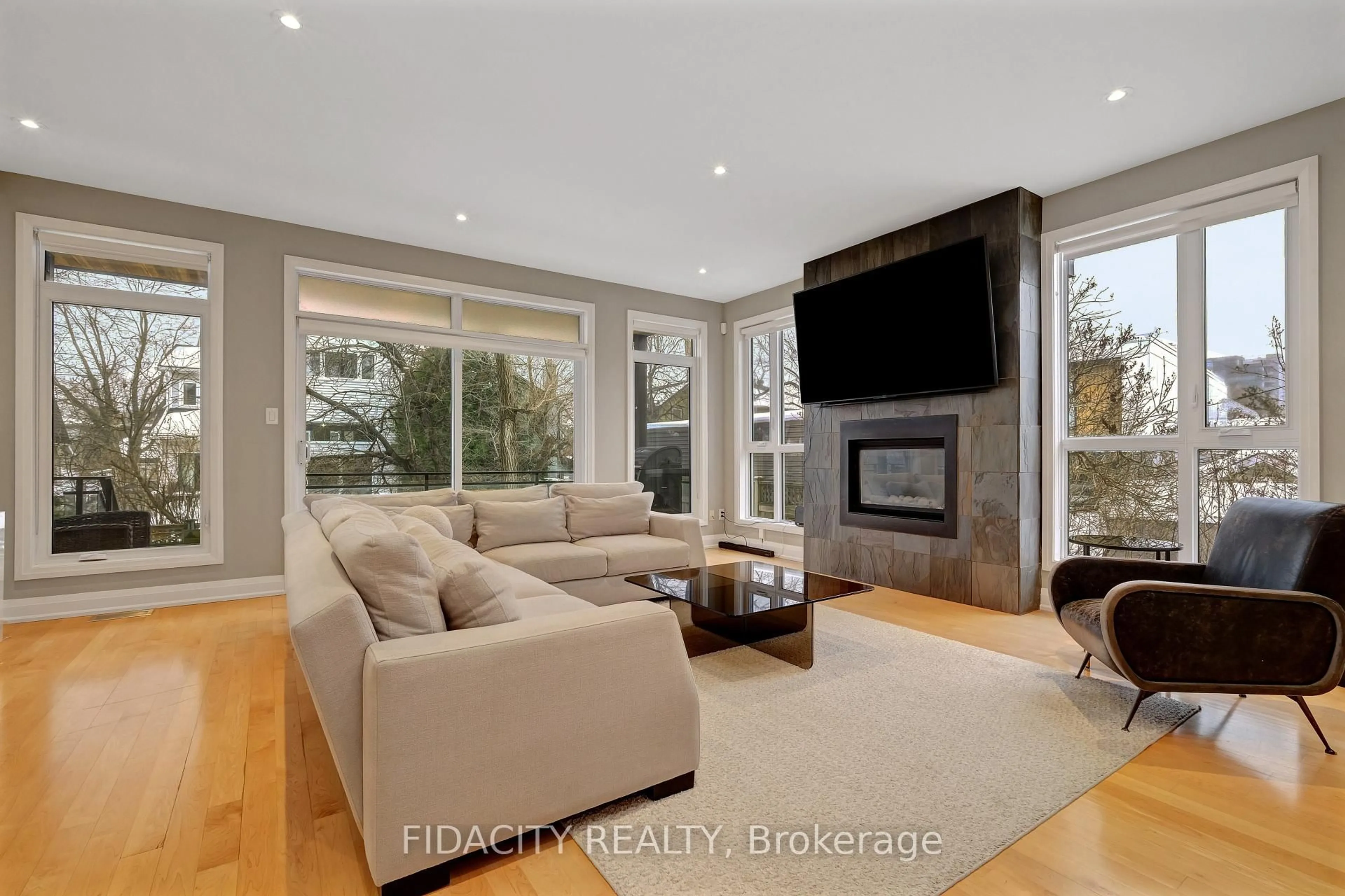 Living room with furniture, wood/laminate floor for 376 C Wilmont Ave, Ottawa Ontario K2A 0B1