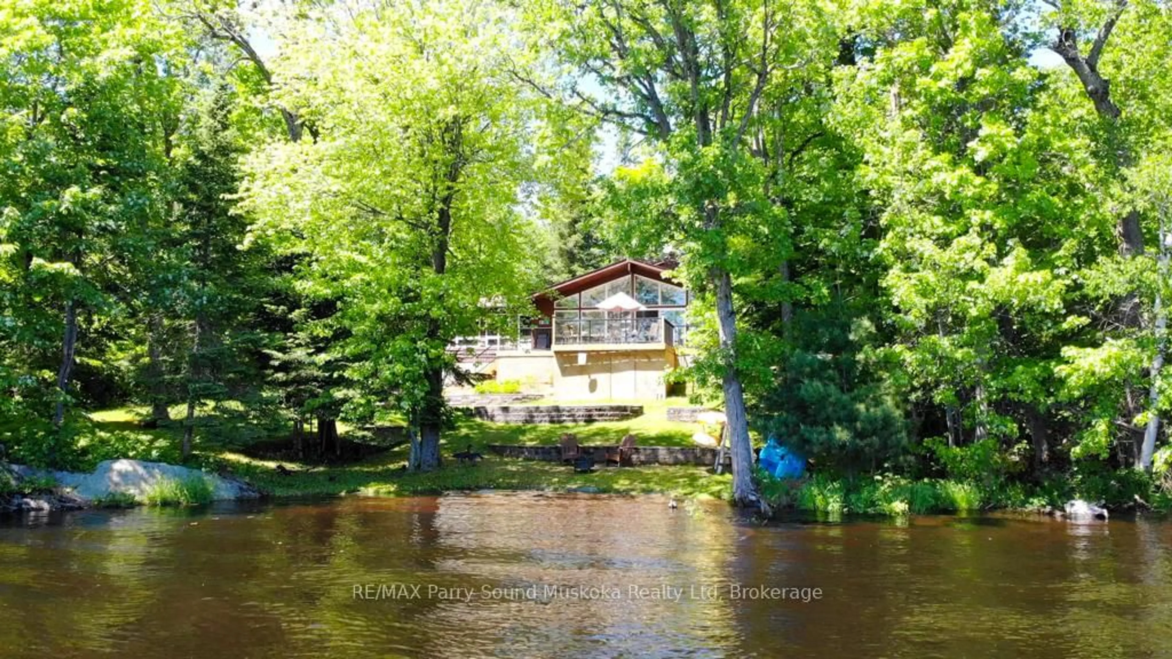 A pic from outside/outdoor area/front of a property/back of a property/a pic from drone, water/lake/river/ocean view for 17 Lizzie's Lane, McKellar Ontario P2A 0B4