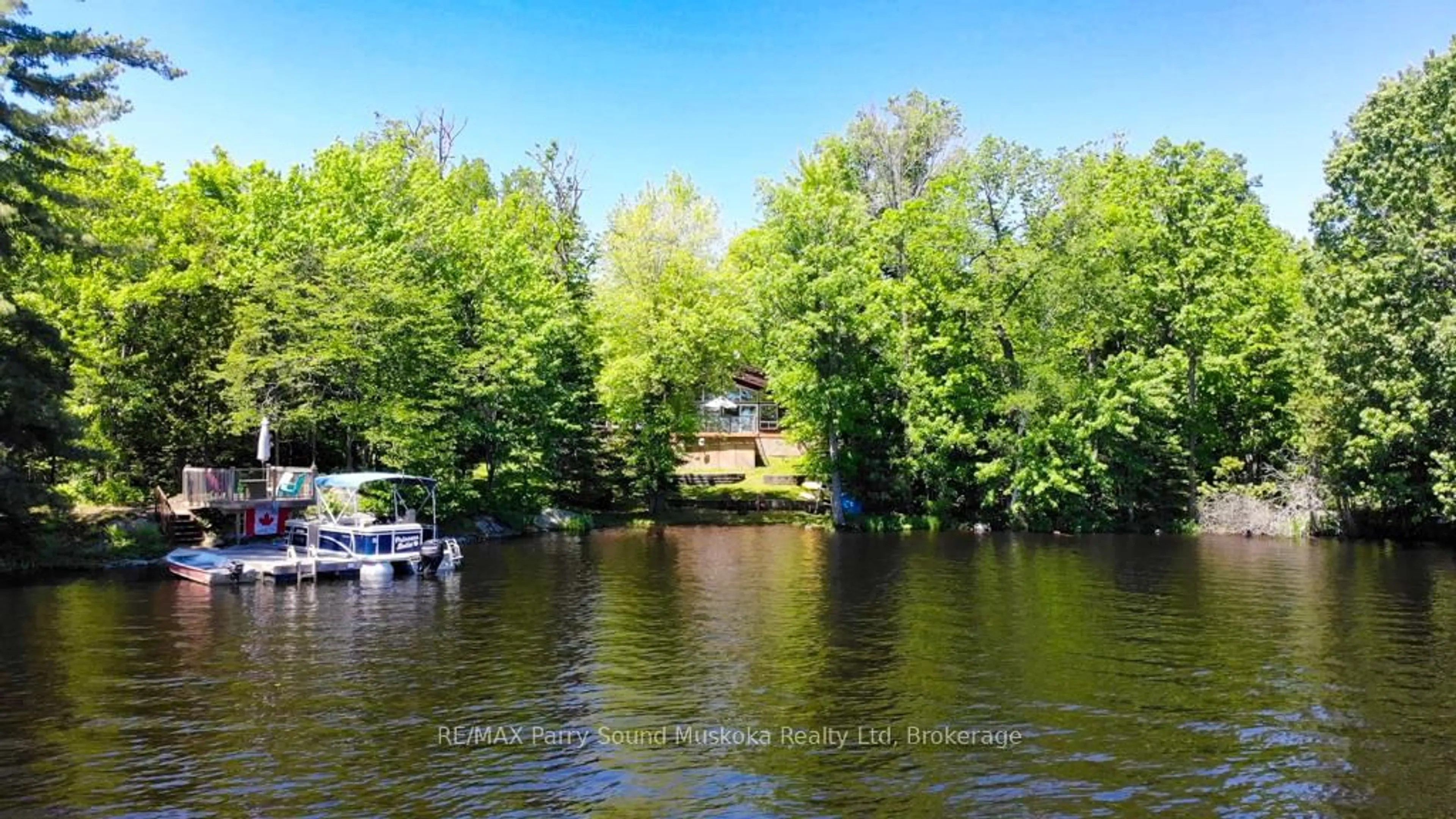 A pic from outside/outdoor area/front of a property/back of a property/a pic from drone, water/lake/river/ocean view for 17 Lizzie's Lane, McKellar Ontario P2A 0B4