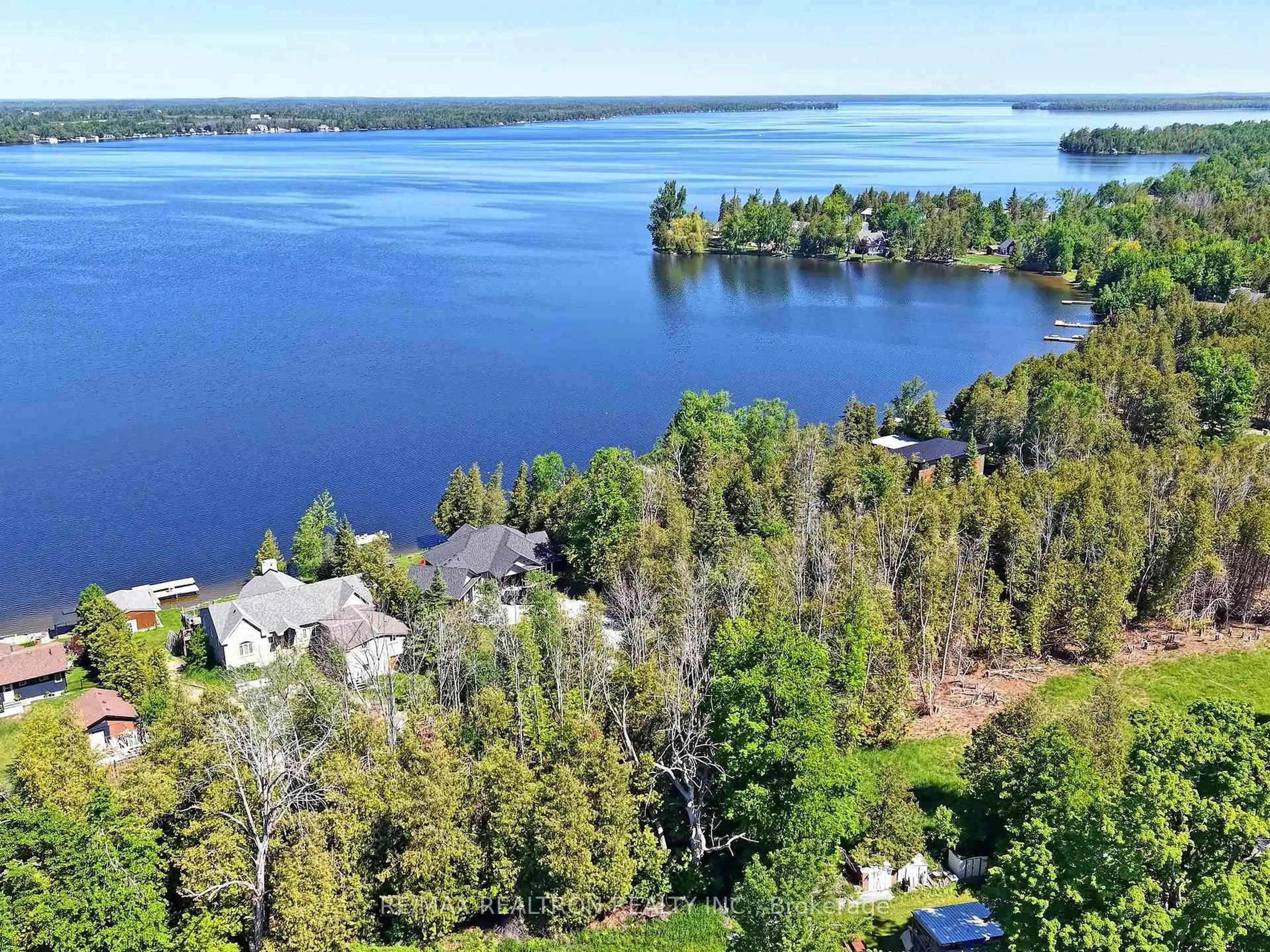 A pic from outside/outdoor area/front of a property/back of a property/a pic from drone, water/lake/river/ocean view for 58 Iris Dr, Kawartha Lakes Ontario K0M 1G0