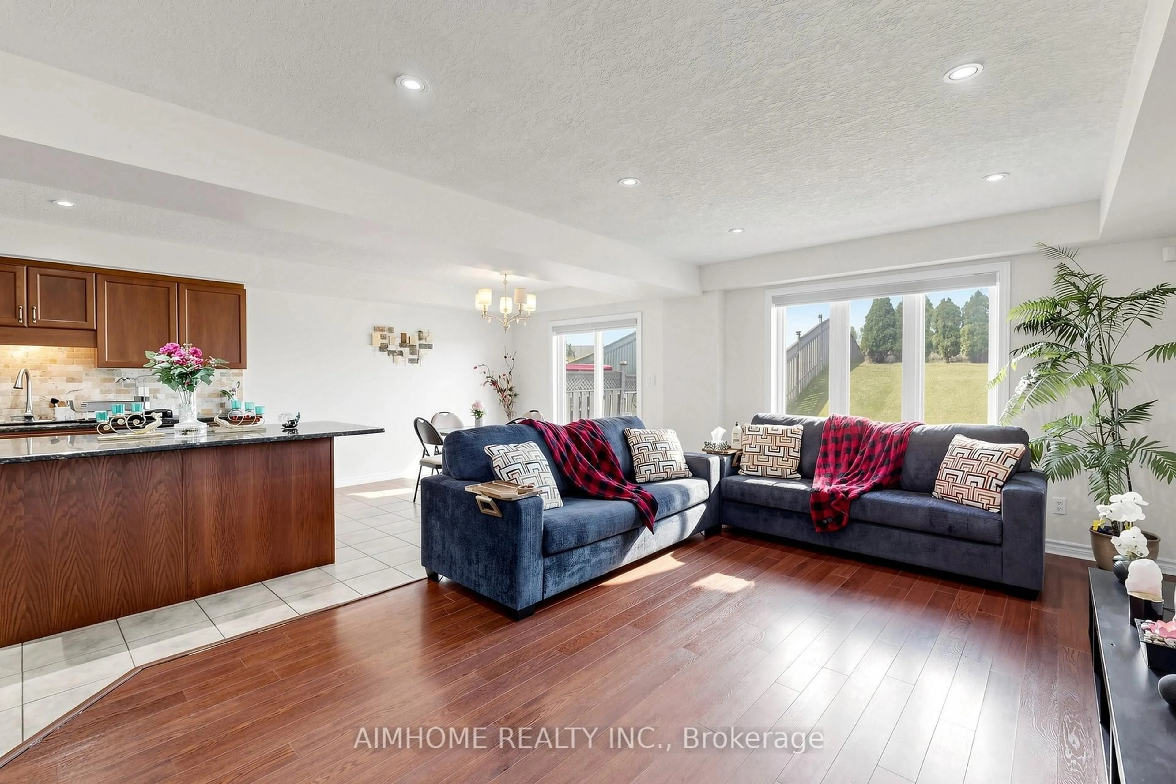 Living room with furniture, wood/laminate floor for 205 Huck Cres, Kitchener Ontario N2N 0A3
