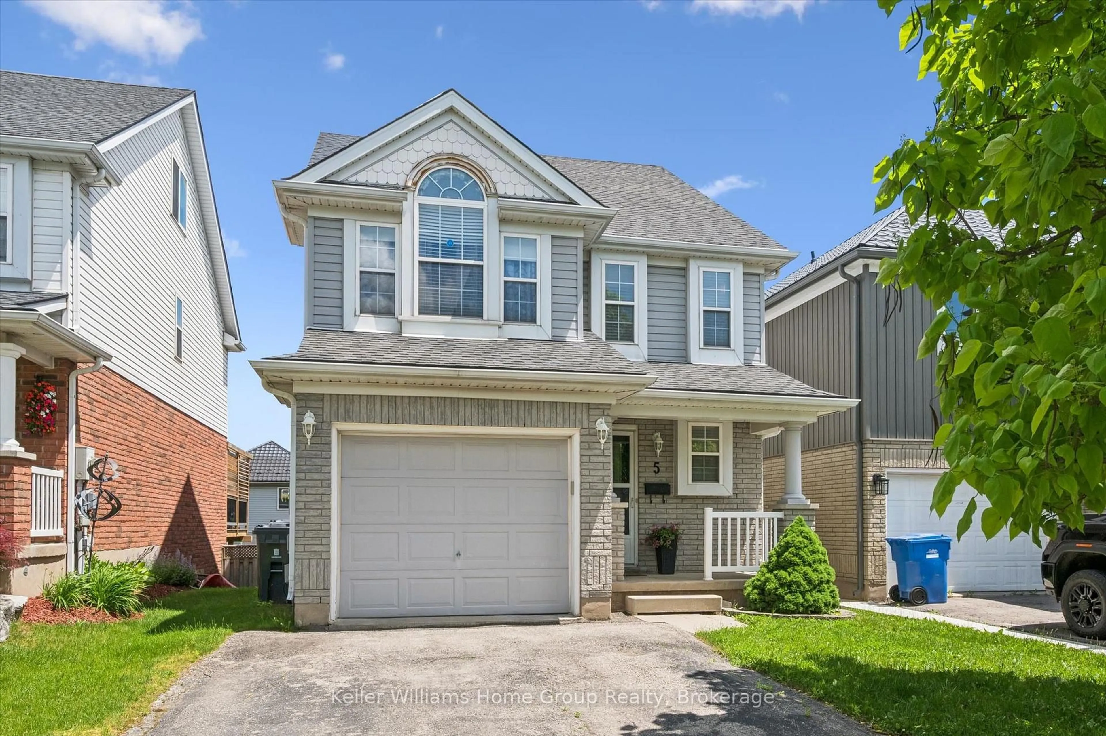 Home with vinyl exterior material, street for 5 Law Dr, Guelph Ontario N1E 7G3