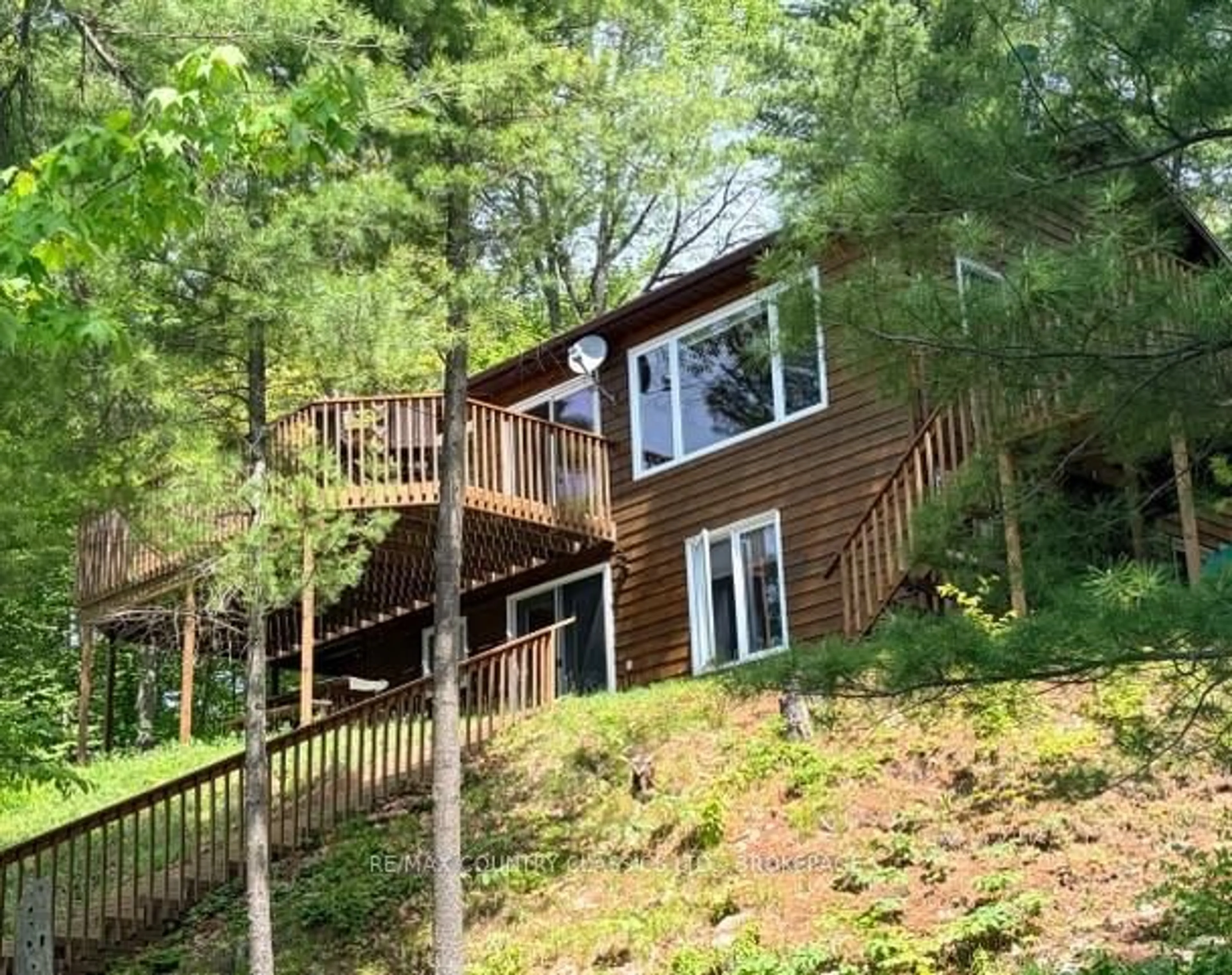 Home with vinyl exterior material, forest/trees view for 242B North Shore Rd, Cloyne Ontario K0H 1K0