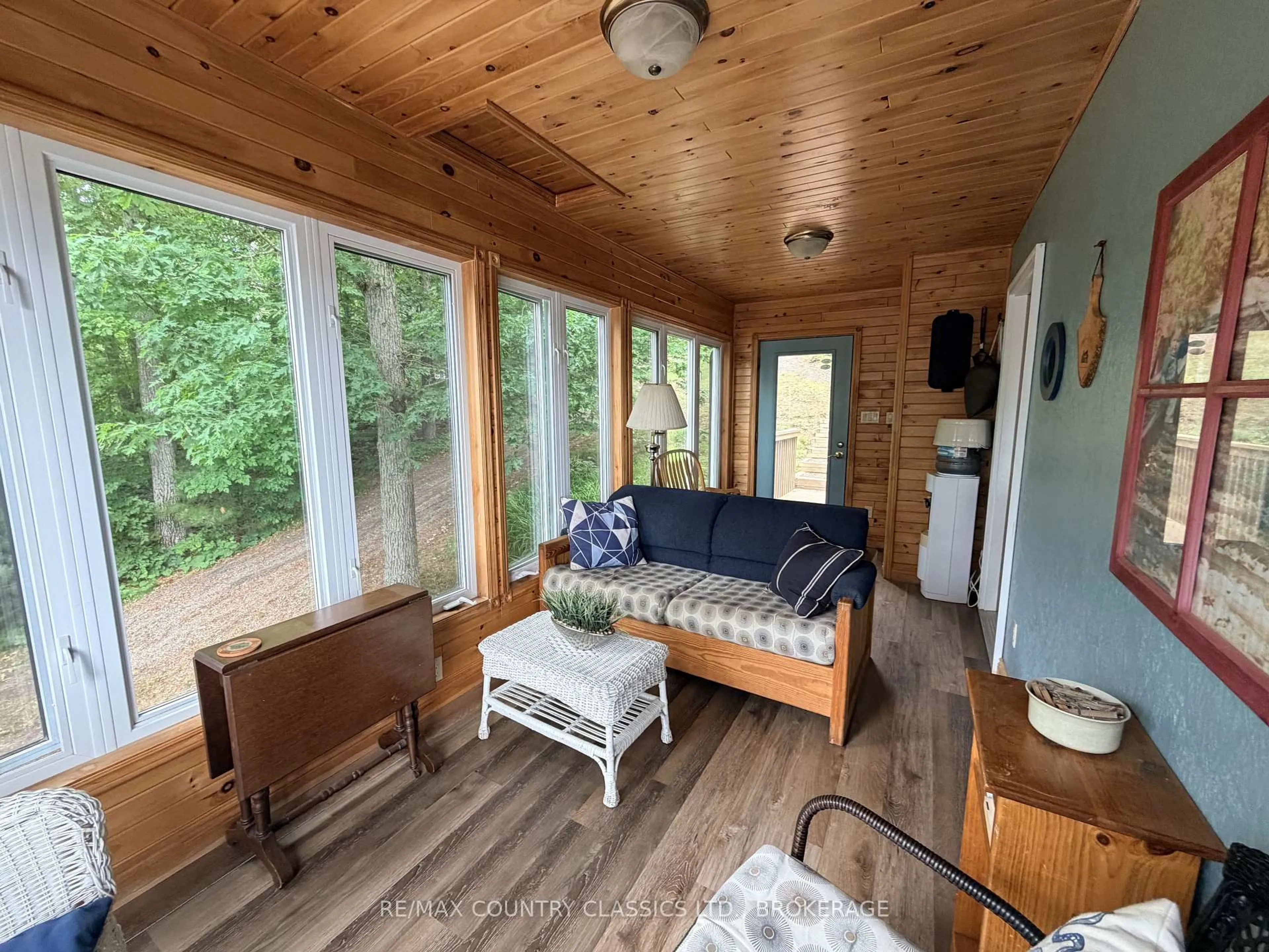 Living room with furniture, wood/laminate floor for 242B North Shore Rd, Cloyne Ontario K0H 1K0