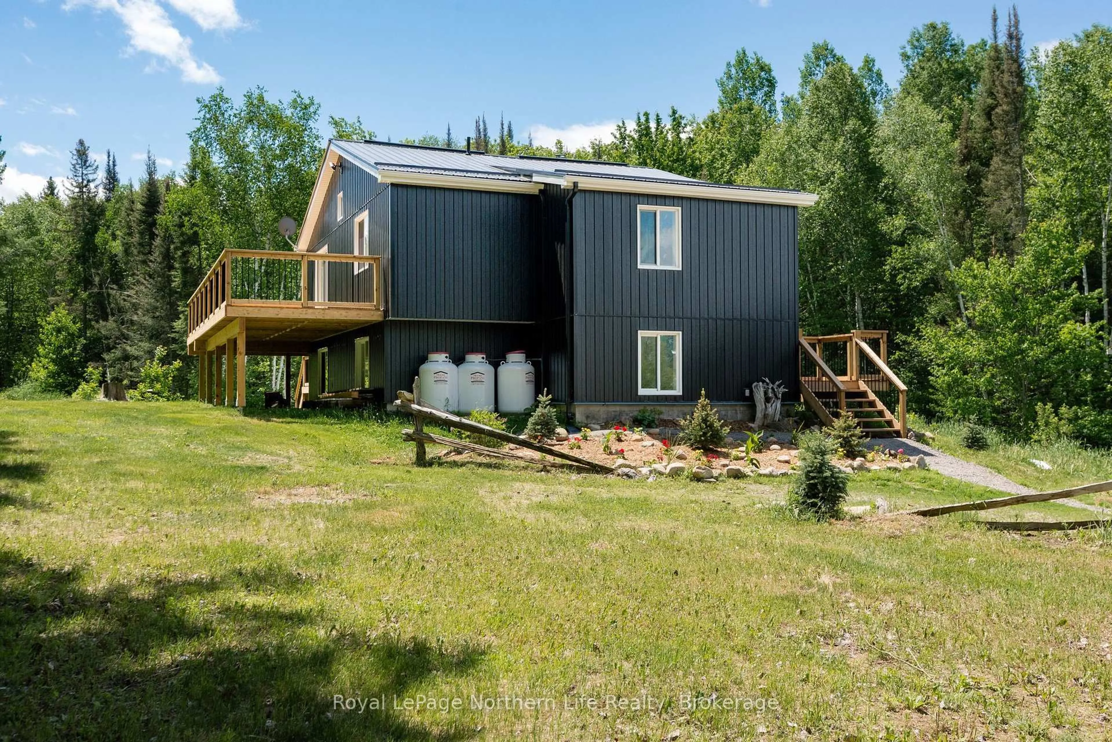 A pic from outside/outdoor area/front of a property/back of a property/a pic from drone, unknown for 70 Highway 17, Bonfield Ontario P0H 1E0
