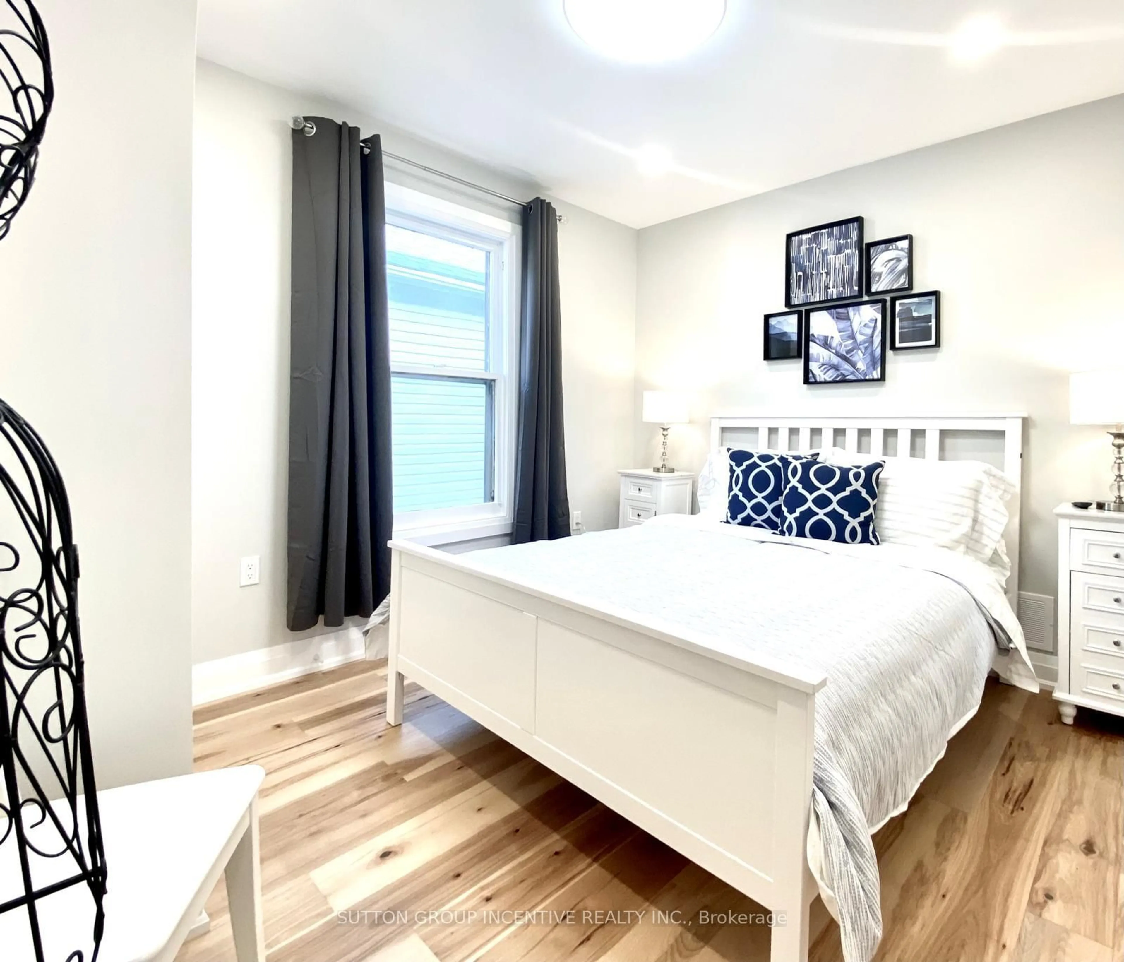 Bedroom with bed, wood/laminate floor for 5151 Kitchener St, Niagara Falls Ontario L2G 1B1