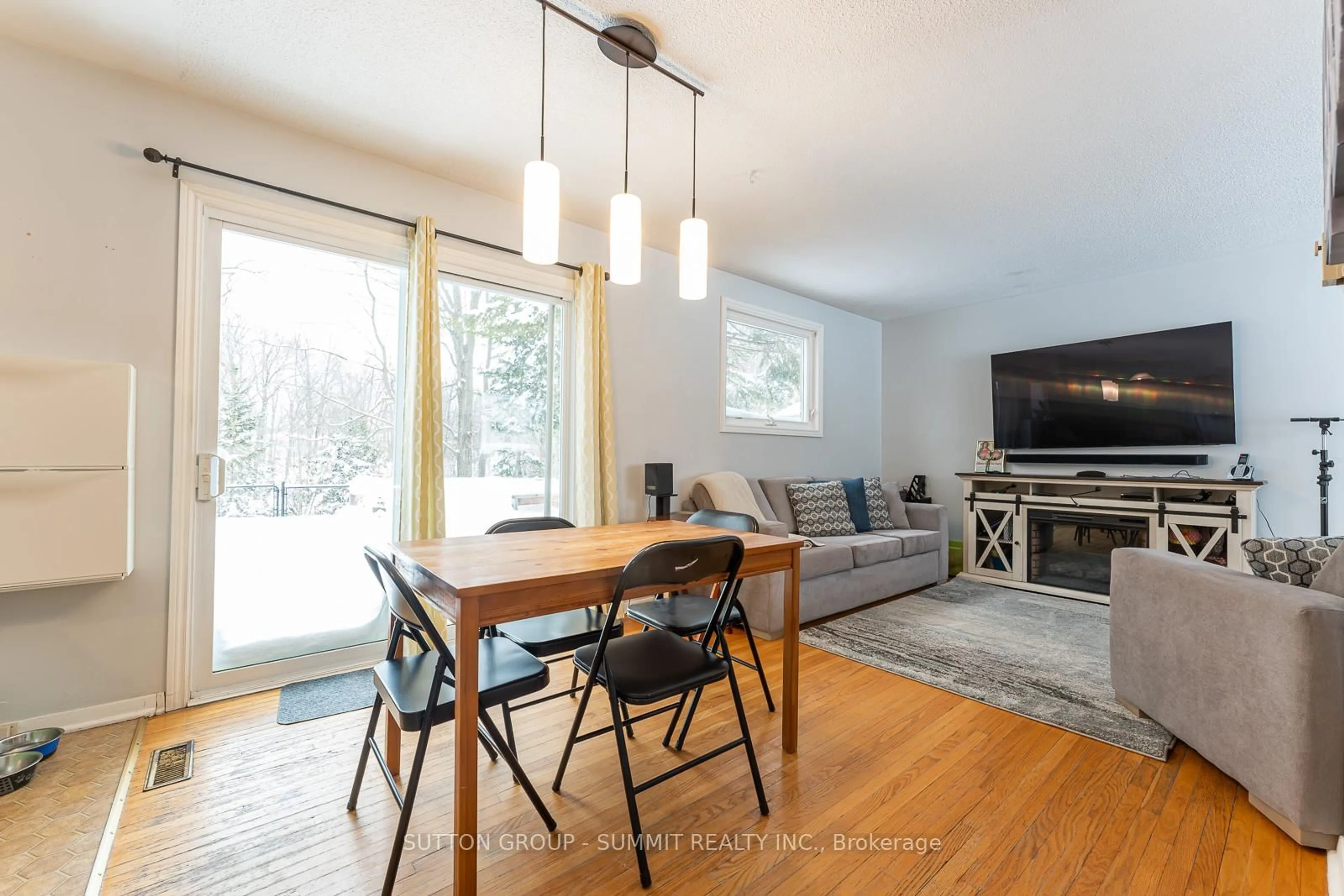 Living room with furniture, wood/laminate floor for 206 6th Ave, Owen Sound Ontario N4K 2T3