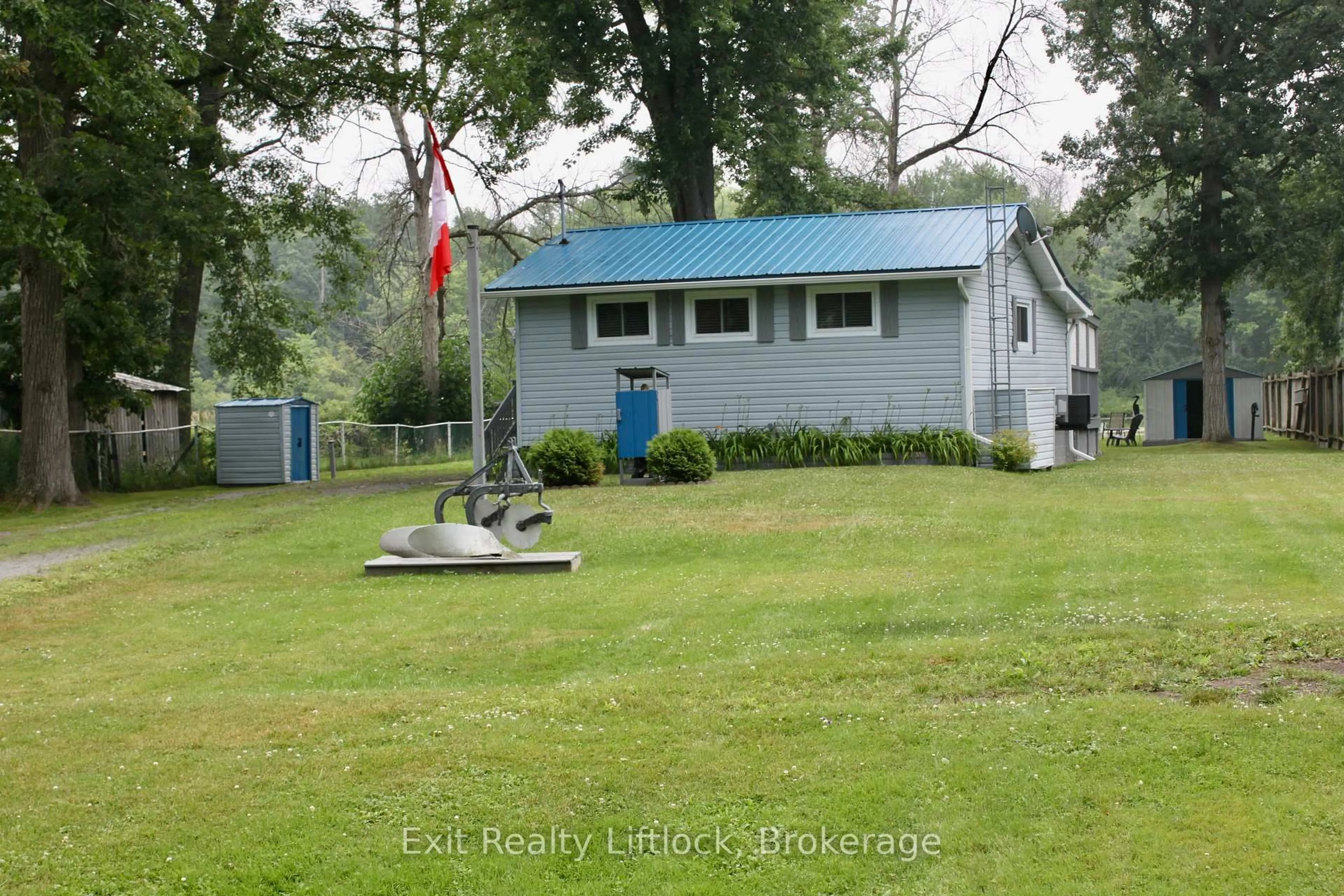 A pic from outside/outdoor area/front of a property/back of a property/a pic from drone, water/lake/river/ocean view for 77 River Rd, Trent Hills Ontario K0L 1L0