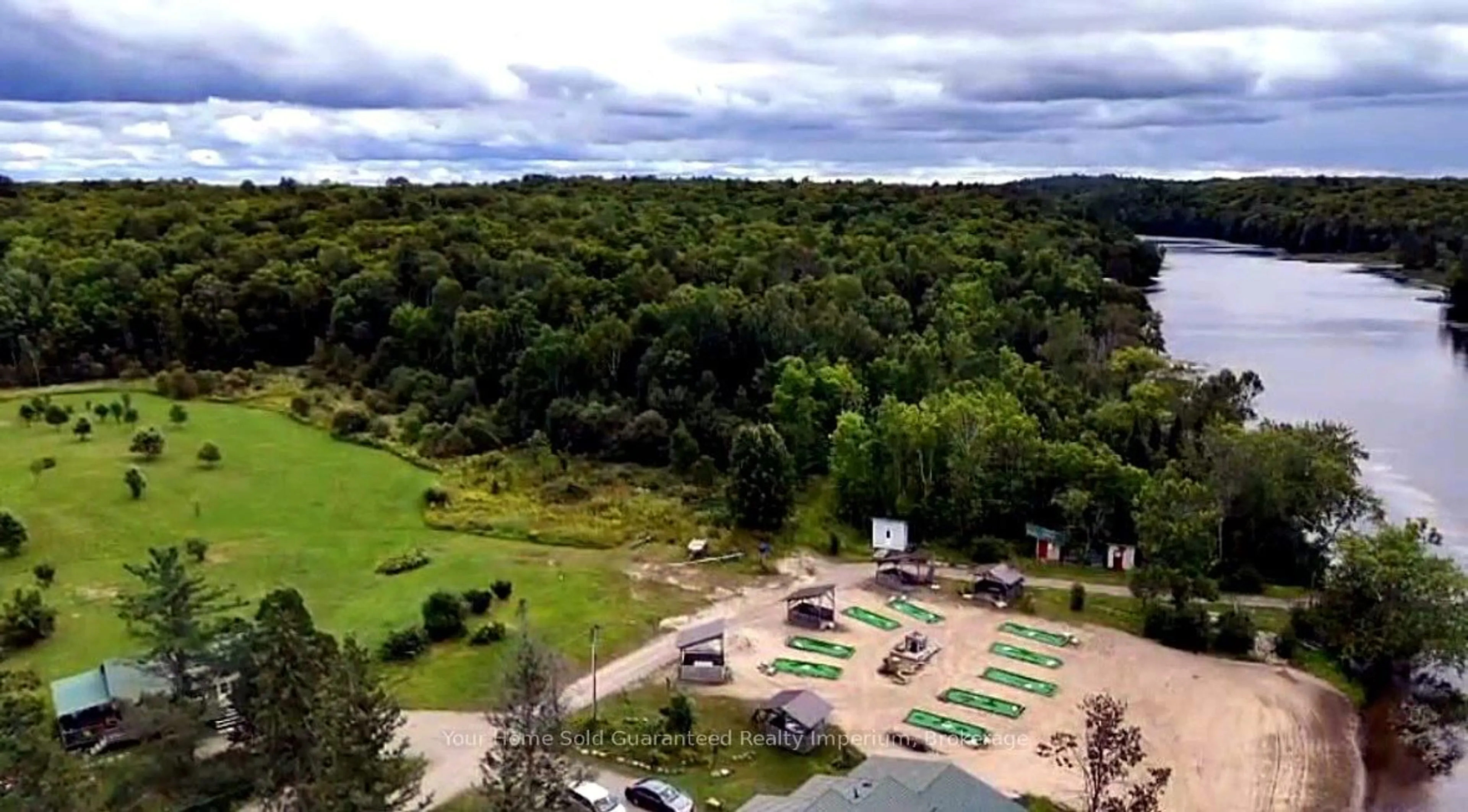 A pic from outside/outdoor area/front of a property/back of a property/a pic from drone, forest/trees view for 3 WOODLAND Lane, Magnetawan Ontario P0A 1P0