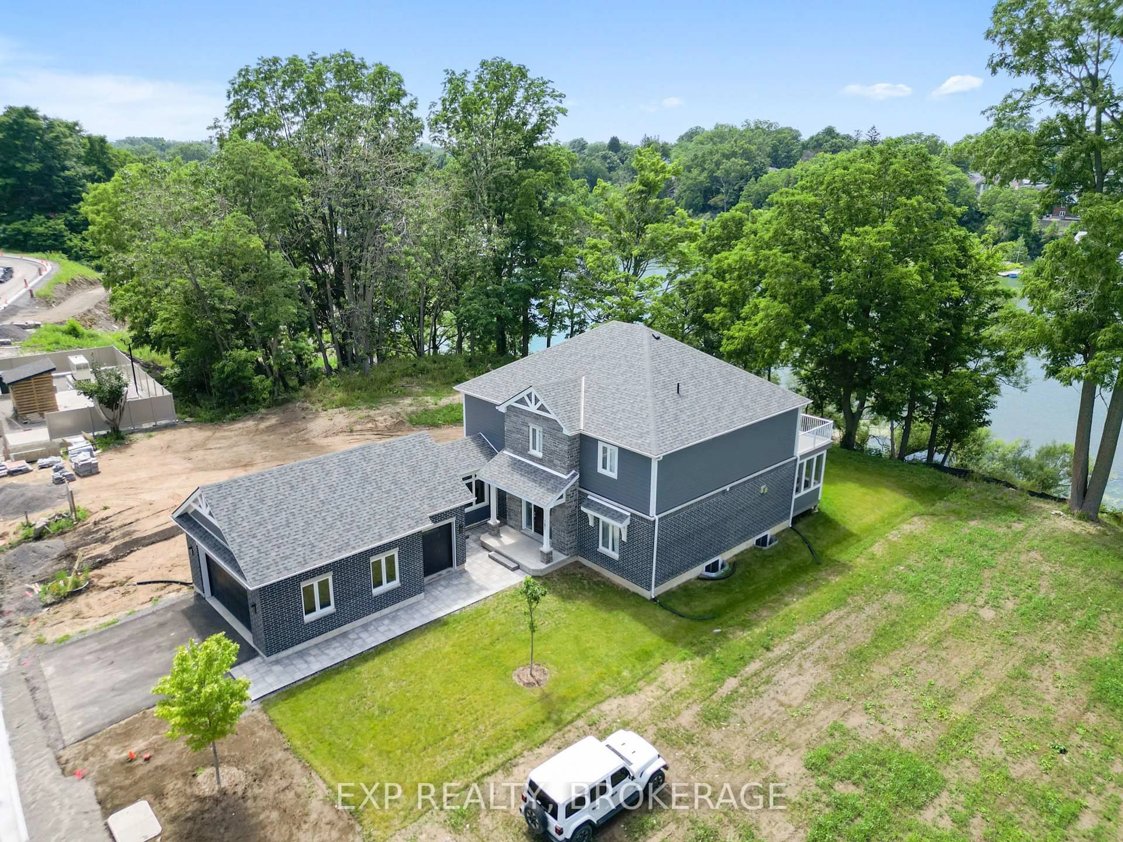 A pic from outside/outdoor area/front of a property/back of a property/a pic from drone, water/lake/river/ocean view for 101 VILLENEUVE Dr, Prince Edward County Ontario K0K 2T0