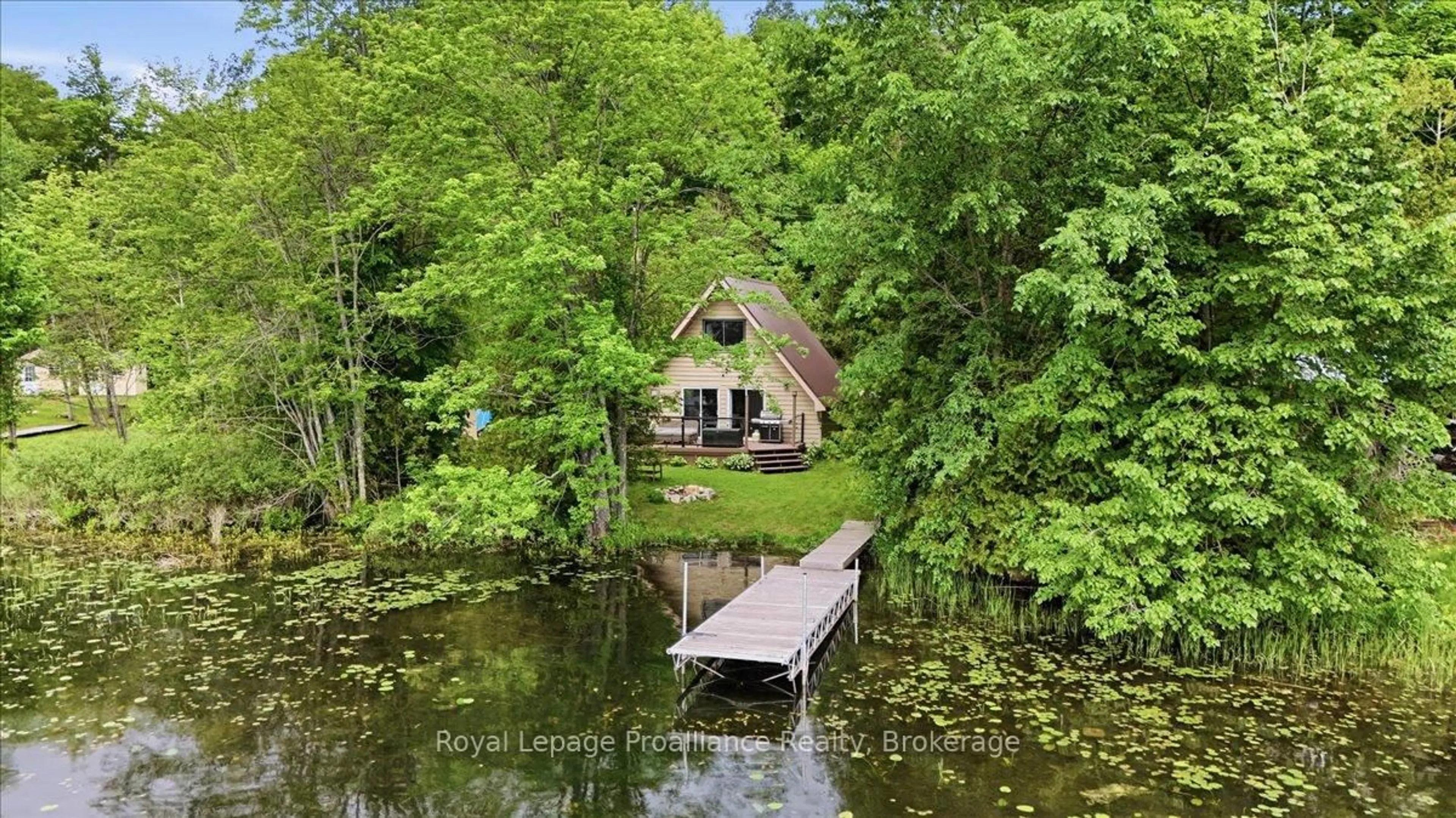 A pic from outside/outdoor area/front of a property/back of a property/a pic from drone, water/lake/river/ocean view for 1062 Price Rd, Frontenac Ontario K0H 0B6