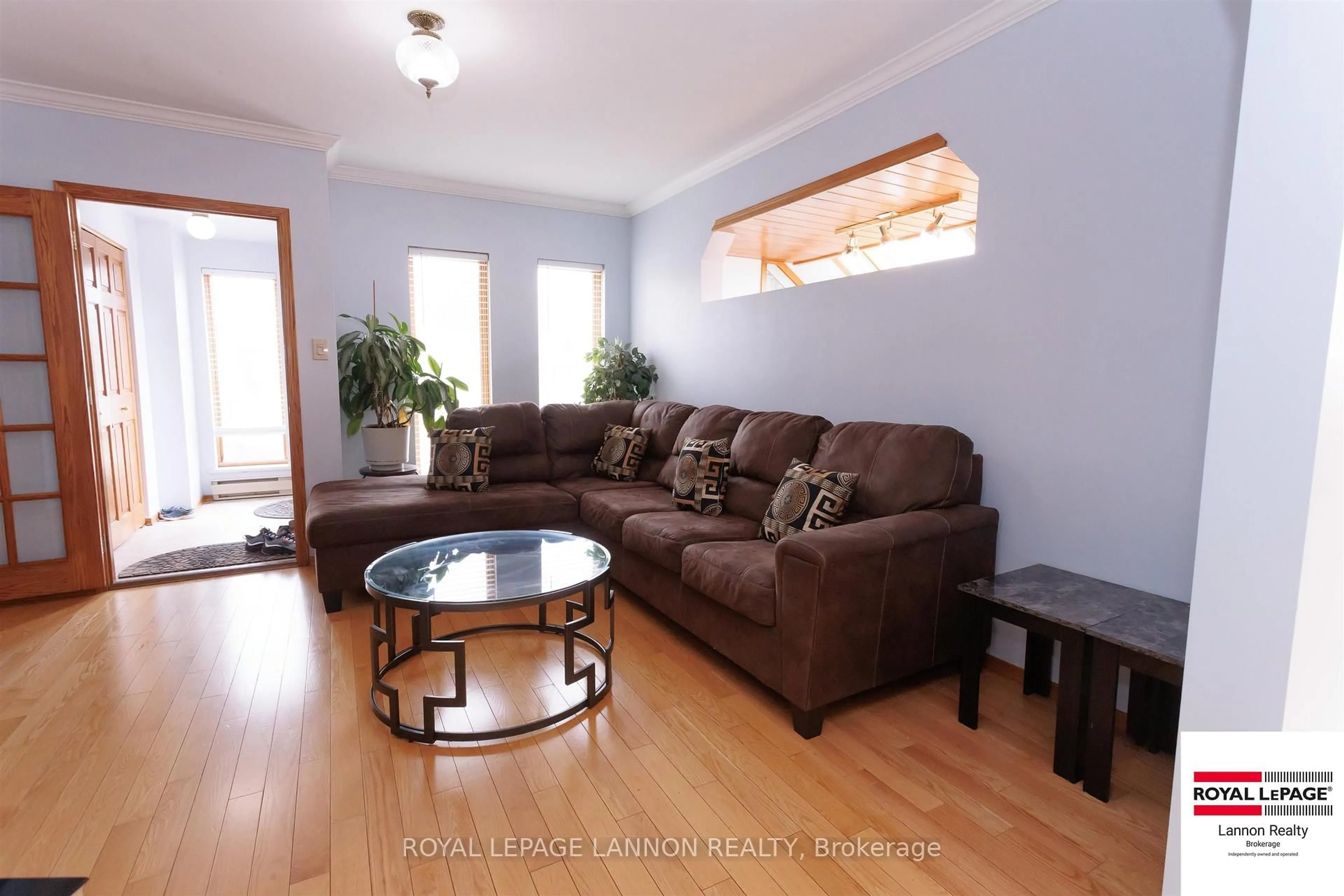 Living room with furniture, wood/laminate floor for 88 Carl Ave, Thunder Bay Ontario P7B 4Z5