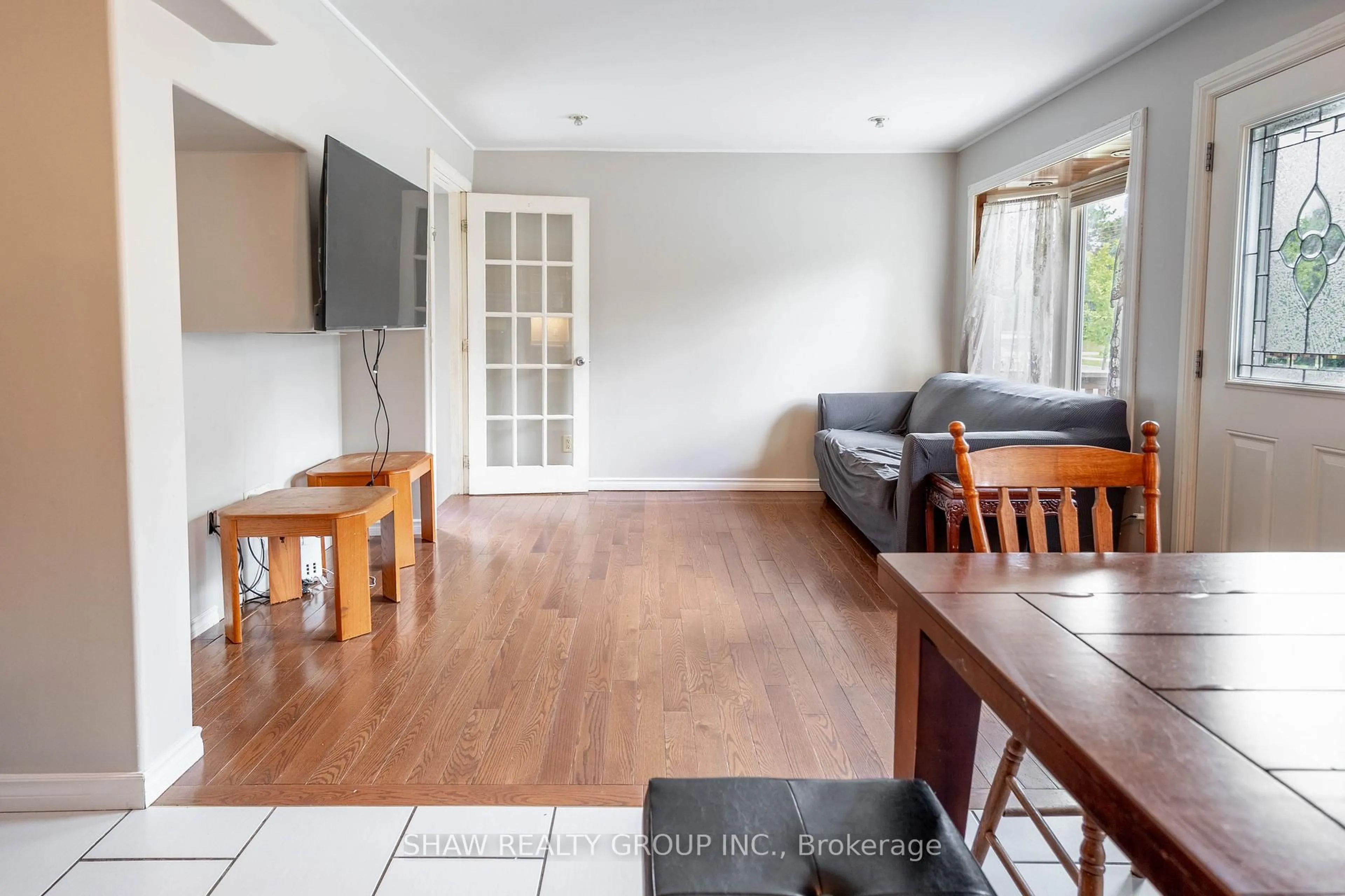 Living room with furniture, wood/laminate floor for 690 Guelph St, Kitchener Ontario N2H 5Y9