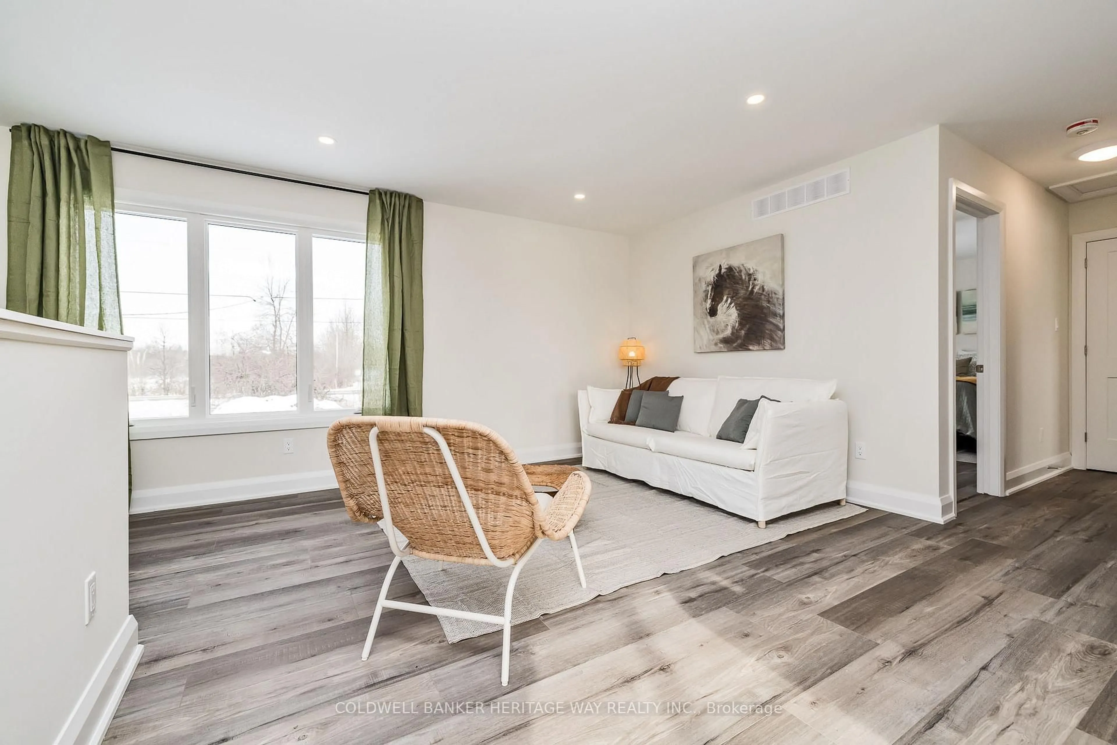 Living room with furniture, wood/laminate floor for 1759 Drummond Con 7 Rd, Perth Ontario K7H 0L8