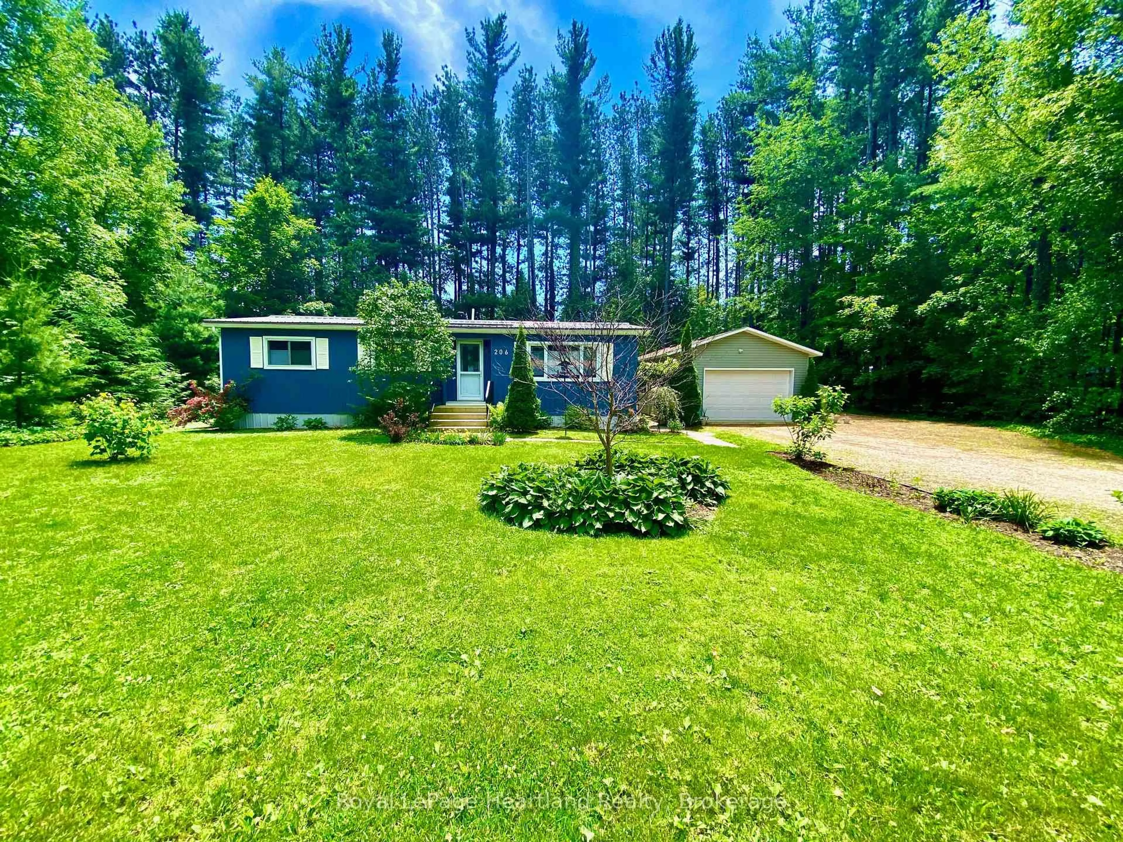 A pic from outside/outdoor area/front of a property/back of a property/a pic from drone, forest/trees view for 206 Chestnut Dr, Central Huron Ontario N0M 1G0