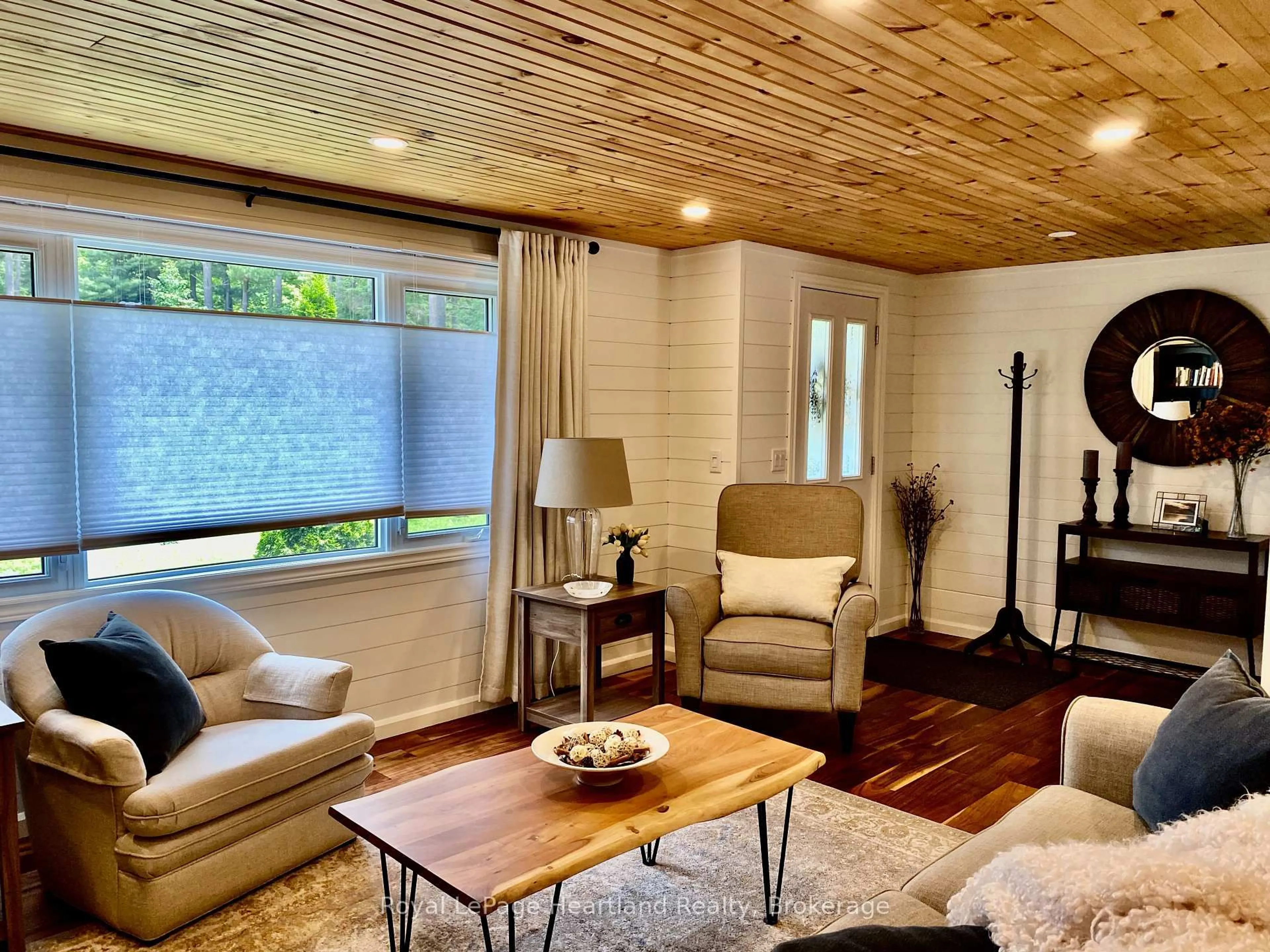 Living room with furniture, wood/laminate floor for 206 Chestnut Dr, Central Huron Ontario N0M 1G0