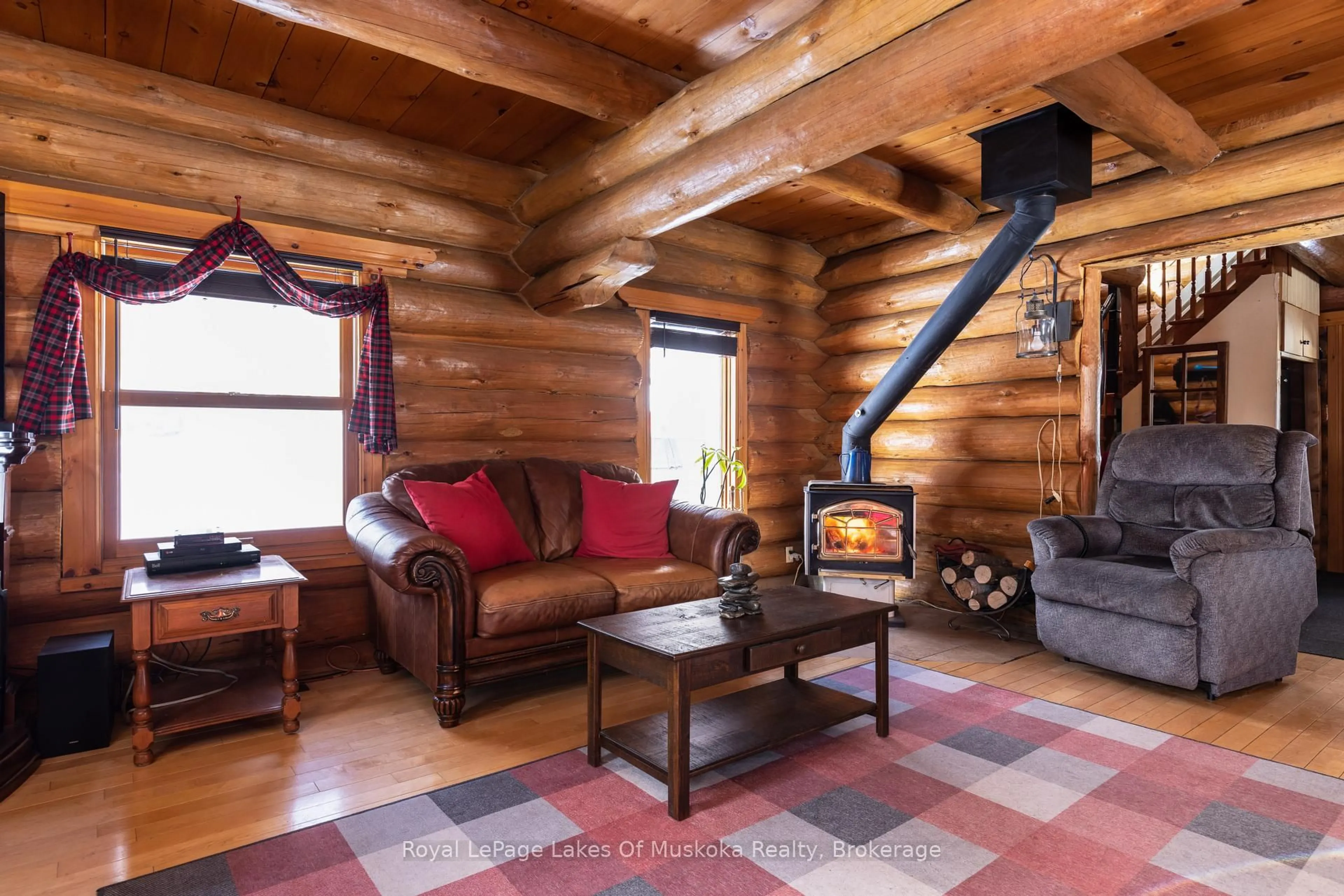 Living room with furniture, wood/laminate floor for 259 Lakeshore Rd, Armour Ontario P0A 1C0