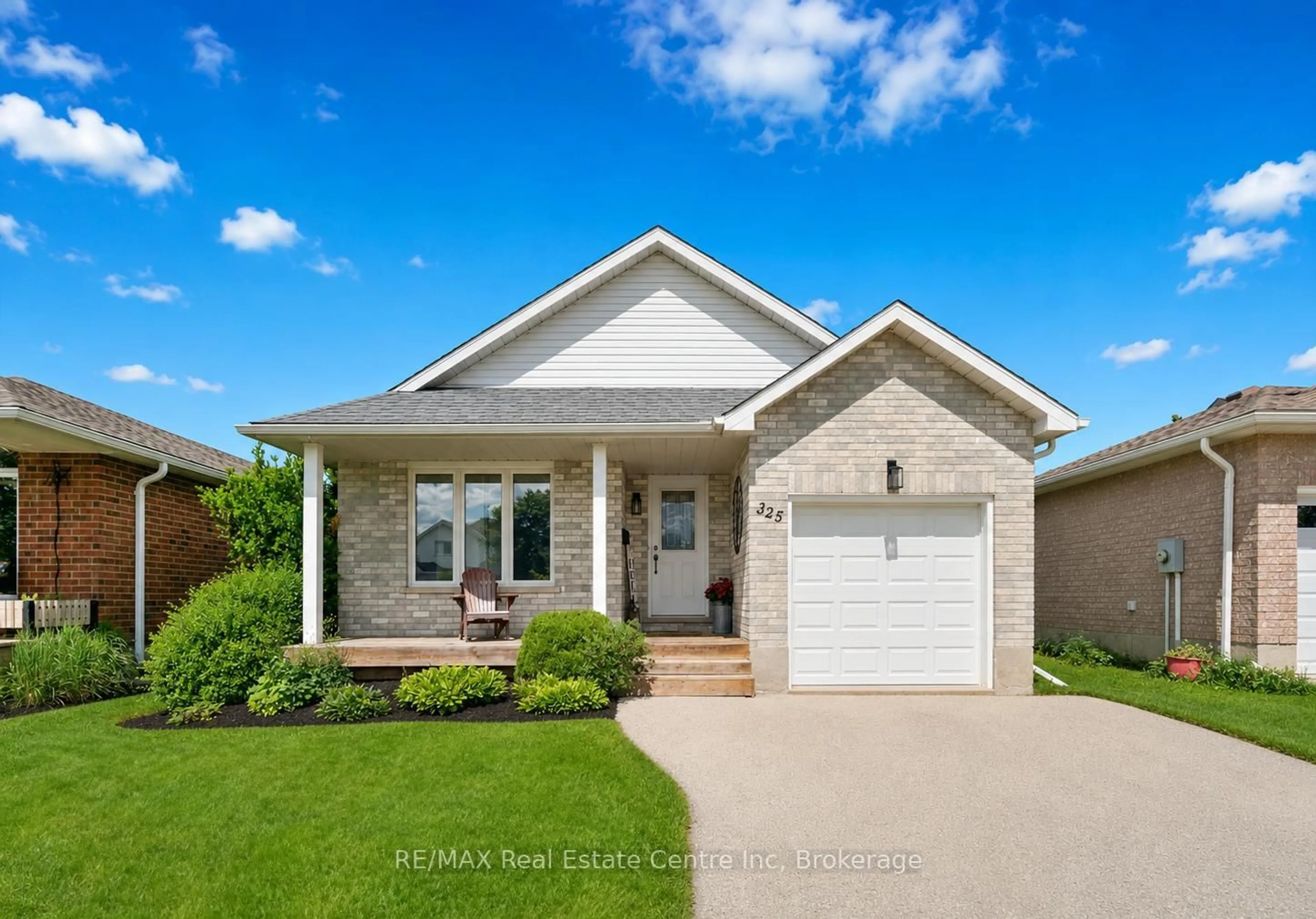 Home with brick exterior material, street for 325 TAIT Cres, Centre Wellington Ontario N1M 3P8