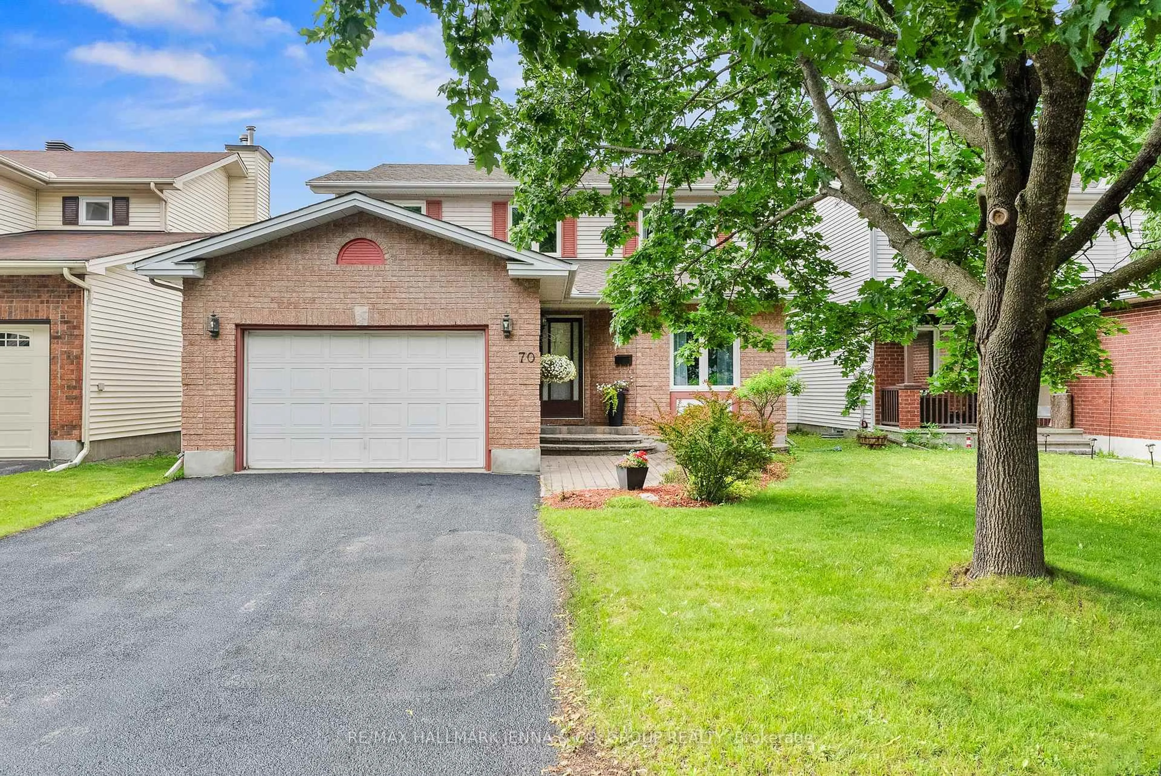 Home with brick exterior material, street for 70 Huntersfield Dr, Ottawa Ontario K1T 3L7