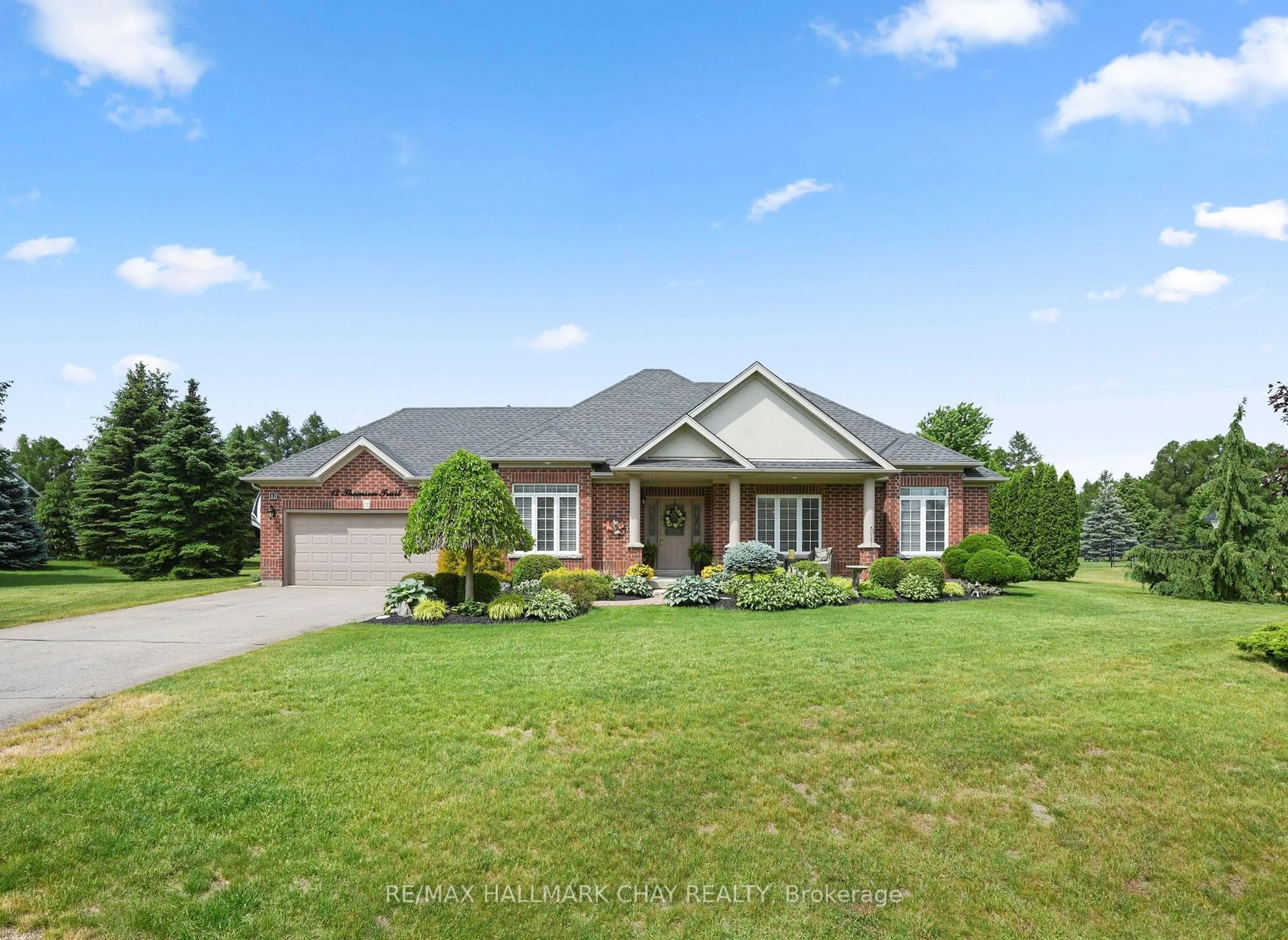 Home with brick exterior material, street for 12 Thomson Tr, Mulmur Ontario L9V 3J1